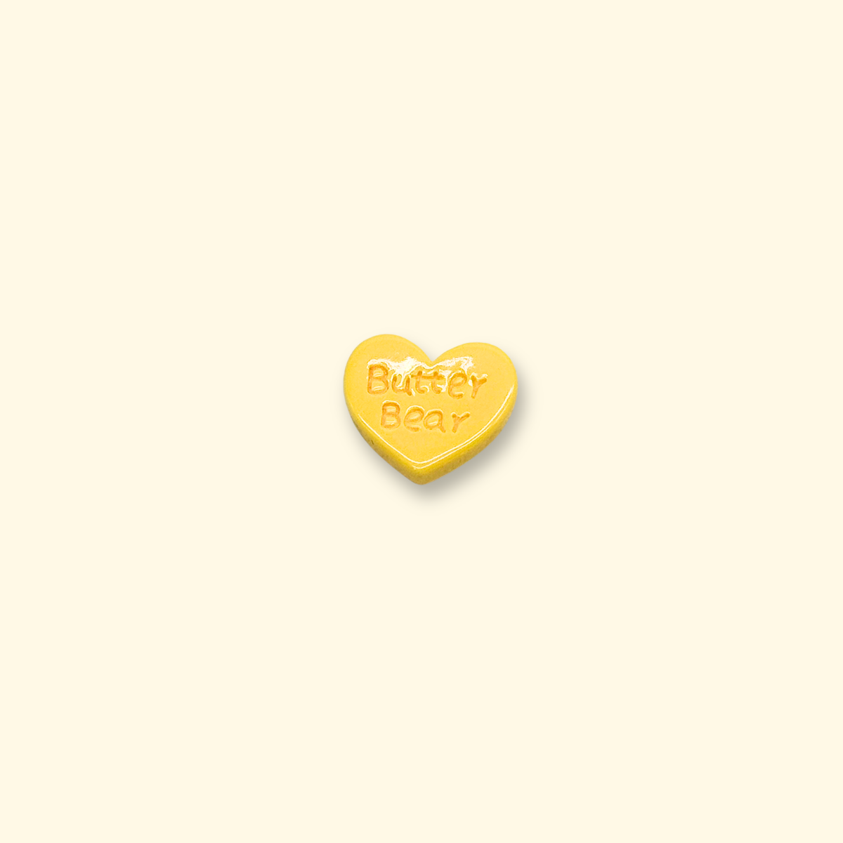 Yellow heart-shaped pet collar charm with "Butter Bear" text, a cute and cheerful design