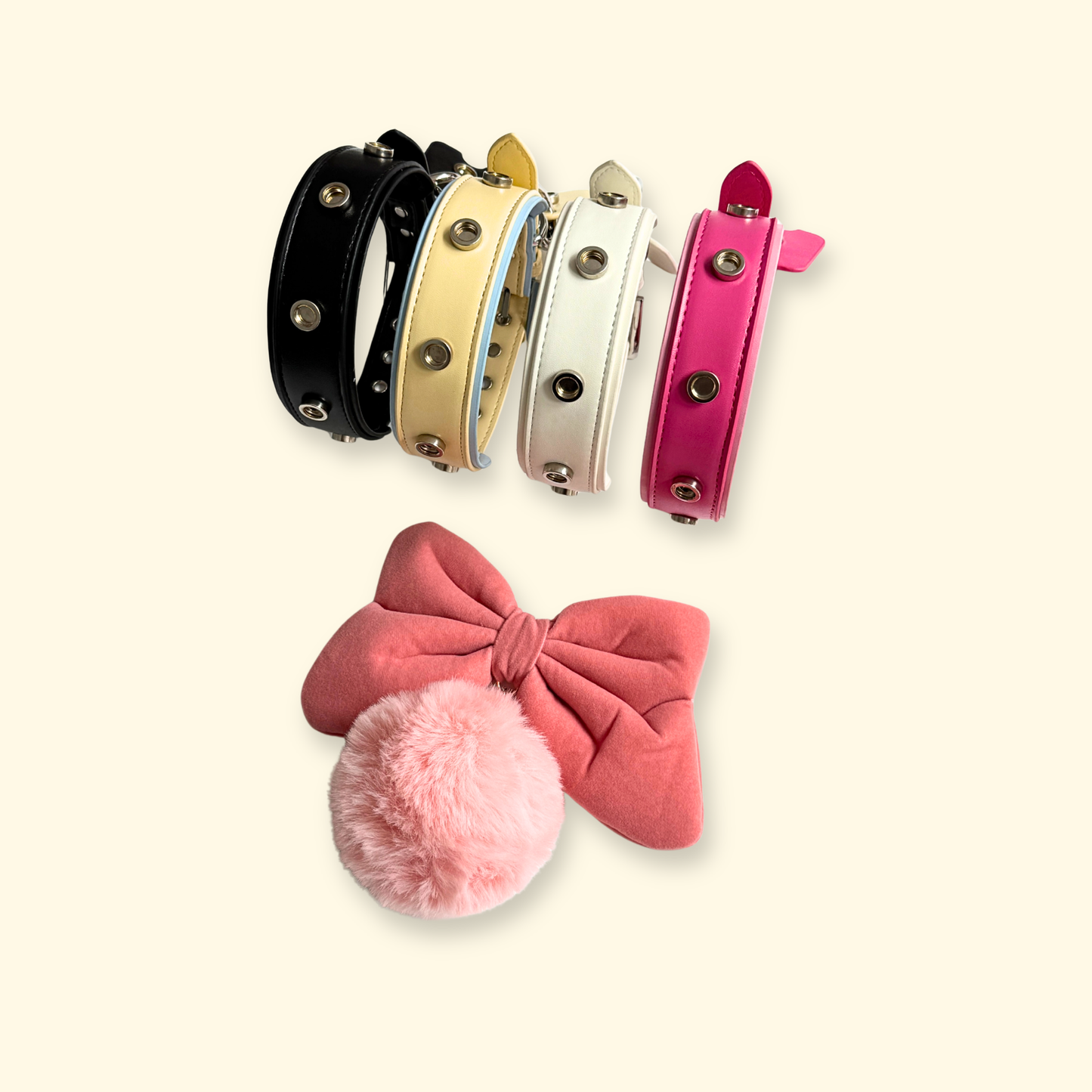 Pink flocked bow and pom charm shown with PETIRIA interchangeable dog collars in multiple colors