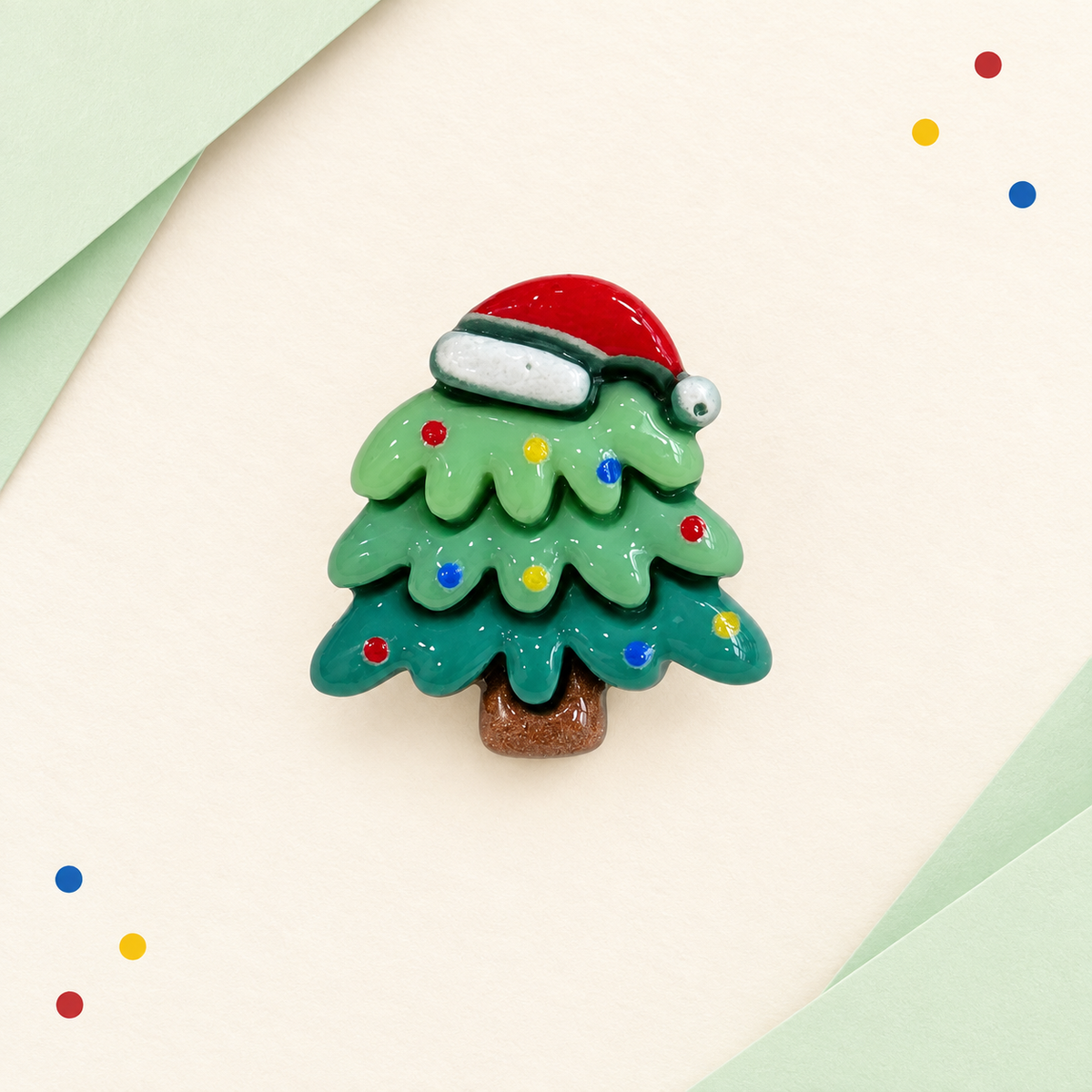 Green Christmas tree dog collar charm with white snow, colorful ornaments and a red Santa hat