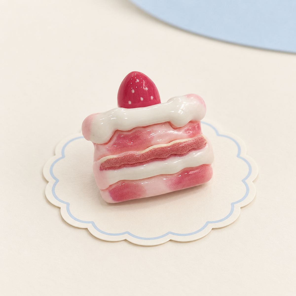Strawberry cream cake dog collar charm with pink layers, white frosting and strawberry topping
