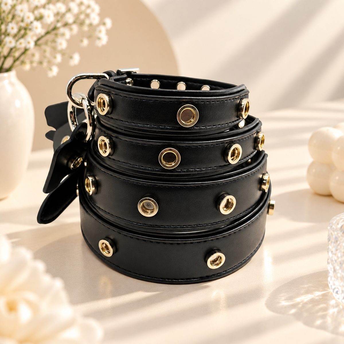 Black PETIRIA interchangeable dog collars in multiple sizes with snap-on charm attachment points