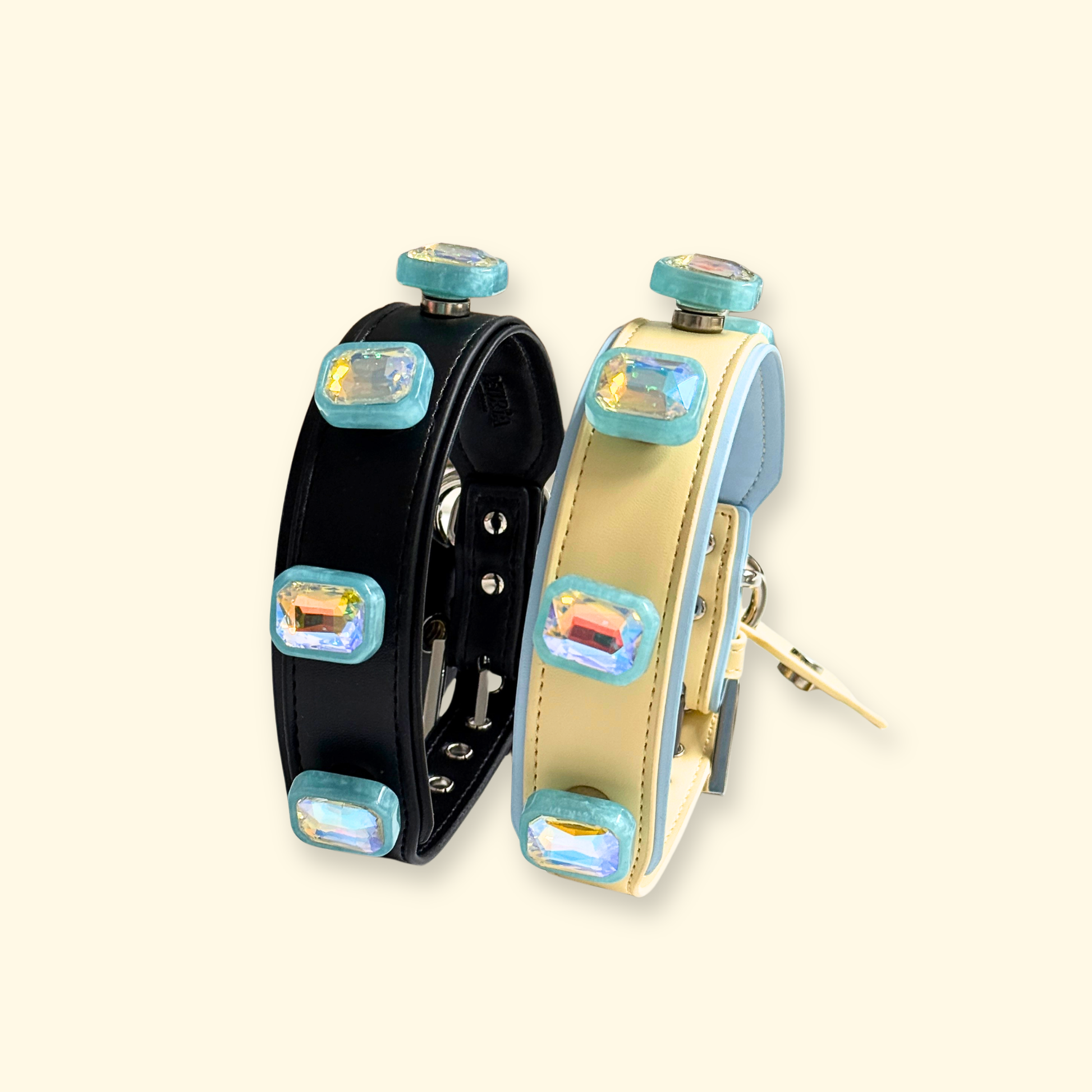 Black and cream PETIRIA interchangeable dog collars styled with blue aurora crystal snap-on charms.