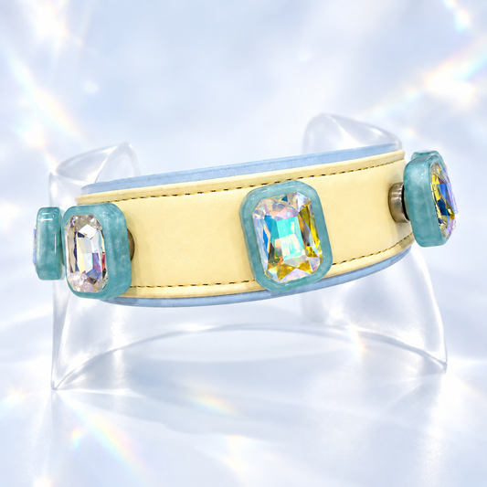 Yellow PETIRIA collar styled with Blue Aurora crystal dog collar charms featuring iridescent faceted stones