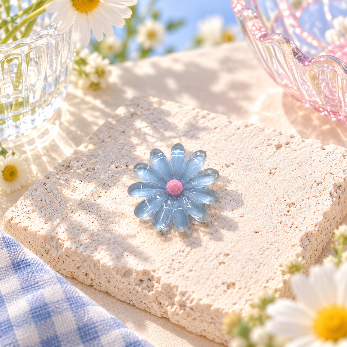Blue Daisy dog collar charm with translucent blue petals and a soft pink center