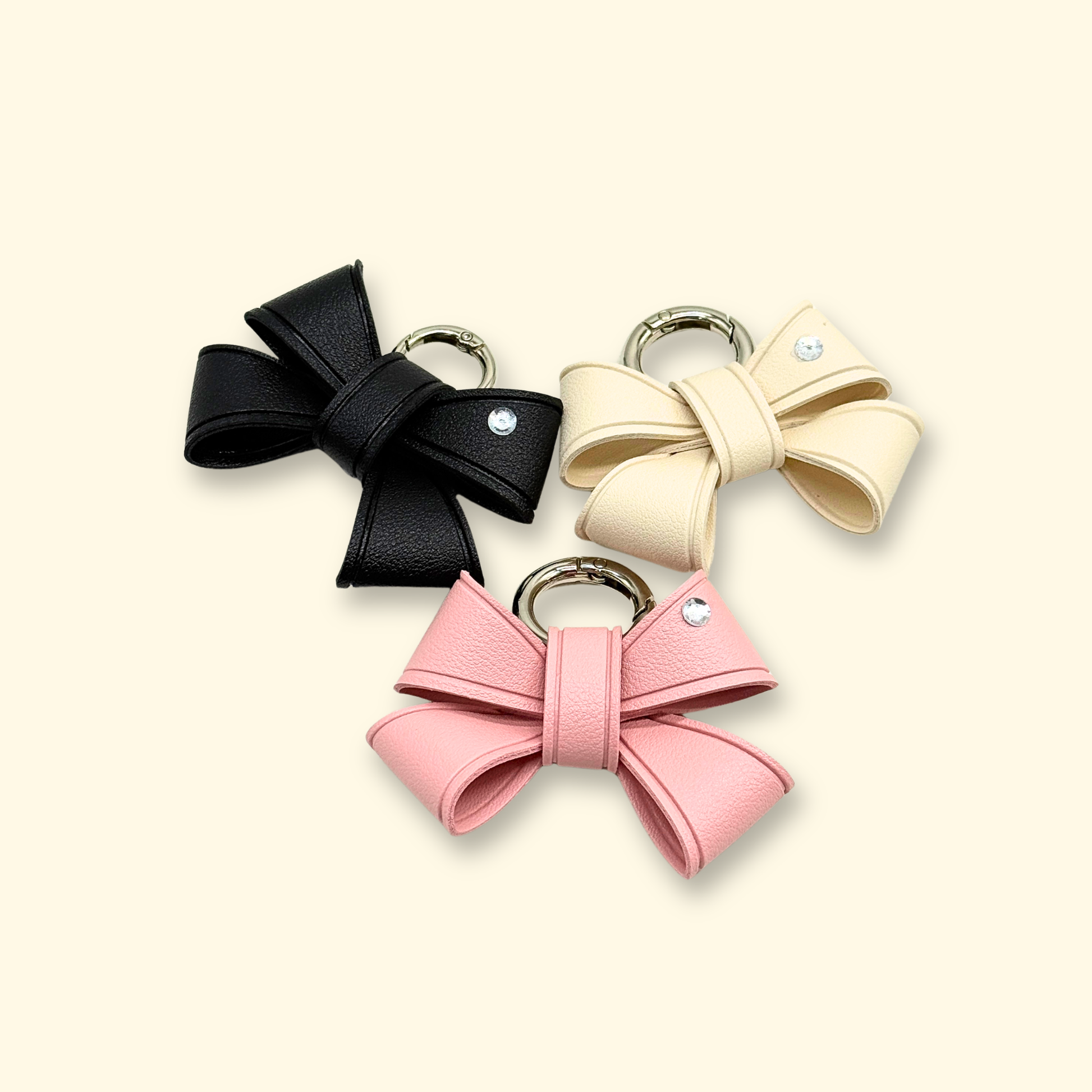 removable bow charms for customizable dog collars in pink black and cream