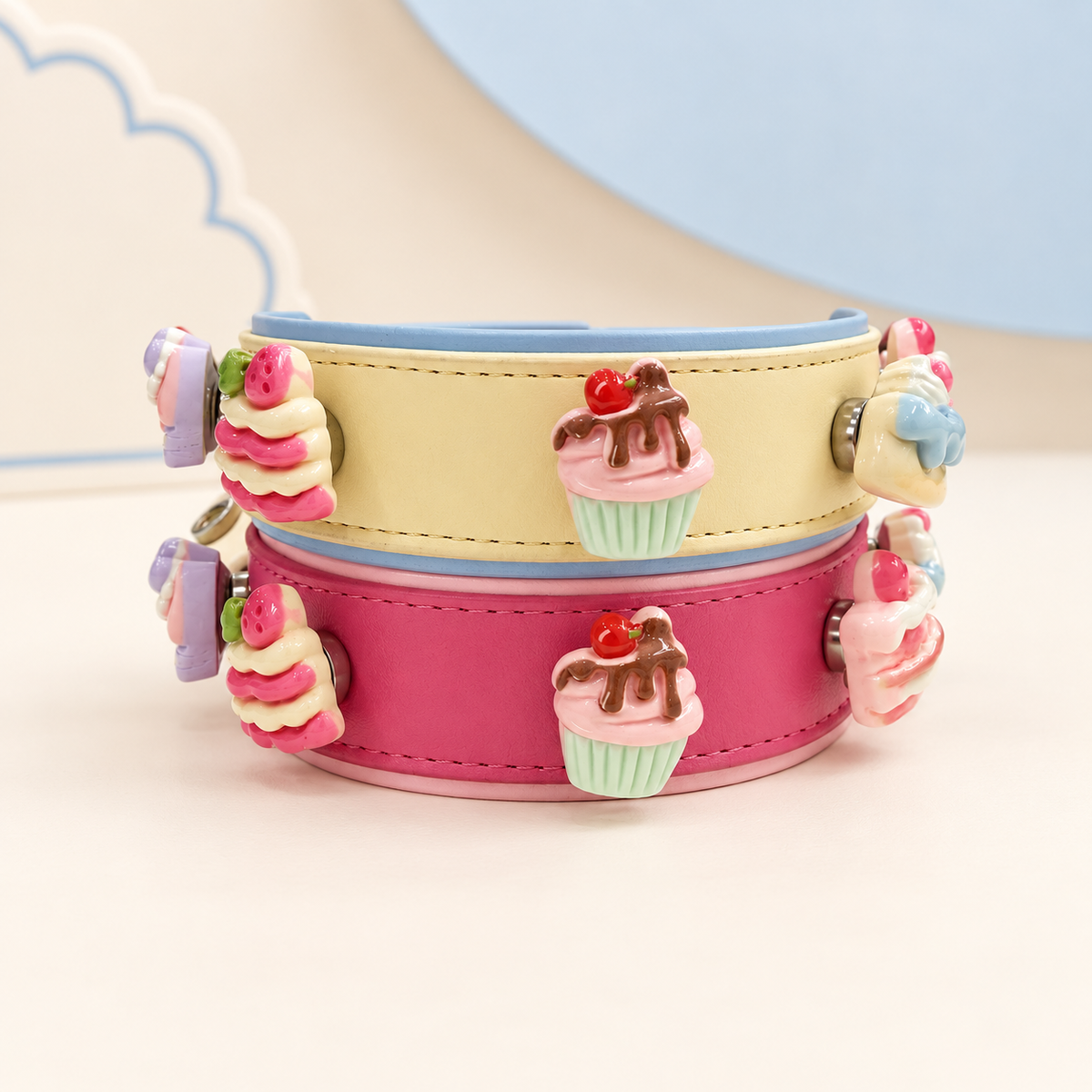 Cute cake and cupcake dog collar charms styled on yellow and pink PETIRIA collars