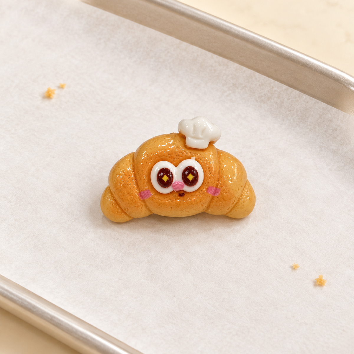 Chef Croissant dog collar charm with a golden croissant design, cute face and white chef hat