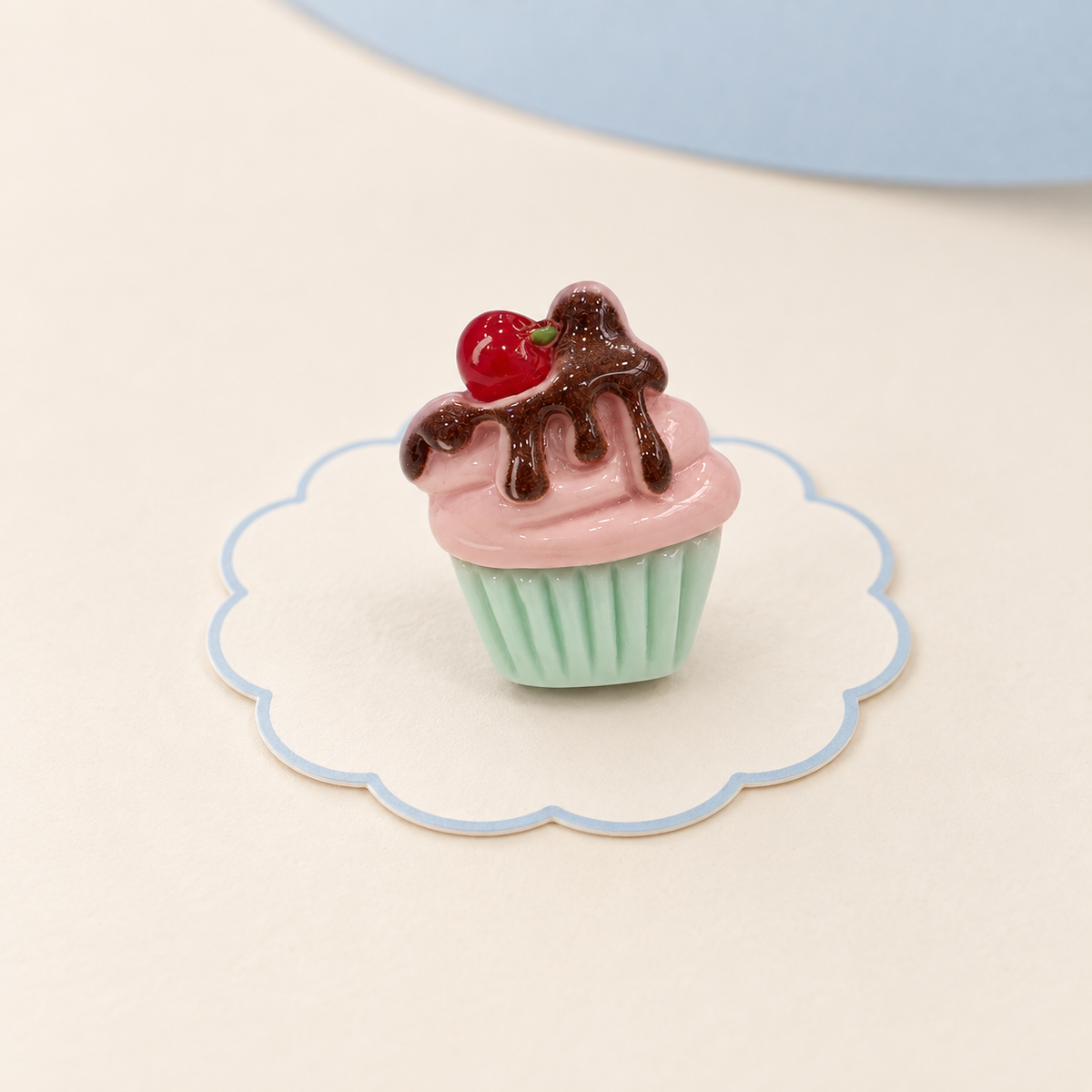 Chocolate cupcake dog collar charm with pink frosting, mint green wrapper and cherry topping