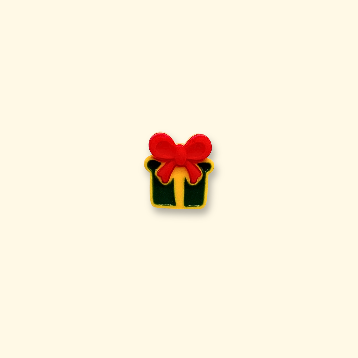 Green and yellow gift box accessory for pet collars with a red bow