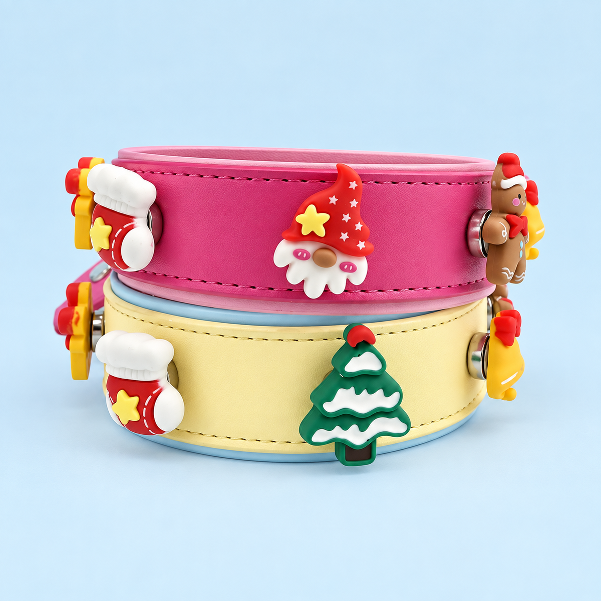 Christmas dog collar charms featuring a gnome, gingerbread man, snowy tree, gift, bell and stocking on Petiria collars