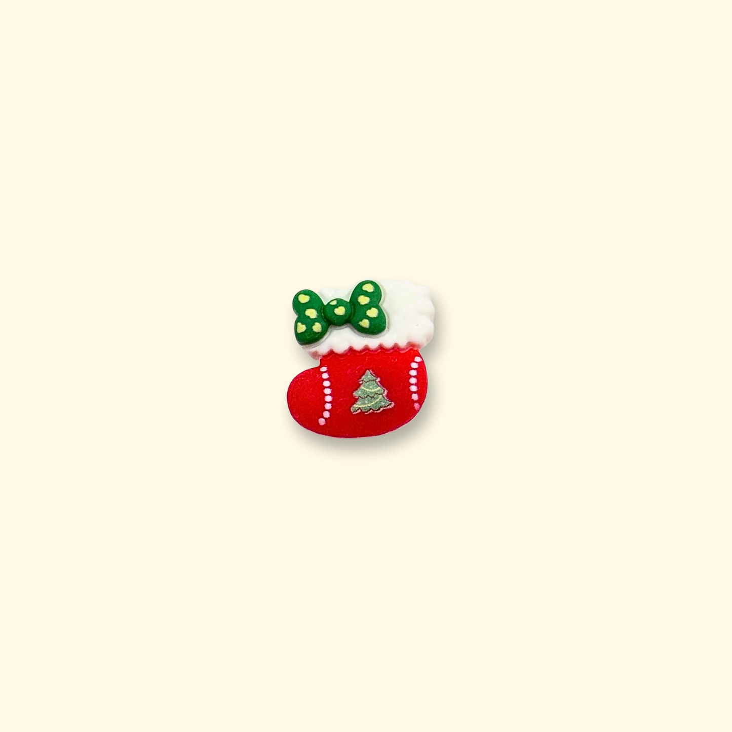 Festive Christmas stocking pet collar charm with snowflake and green bow design.