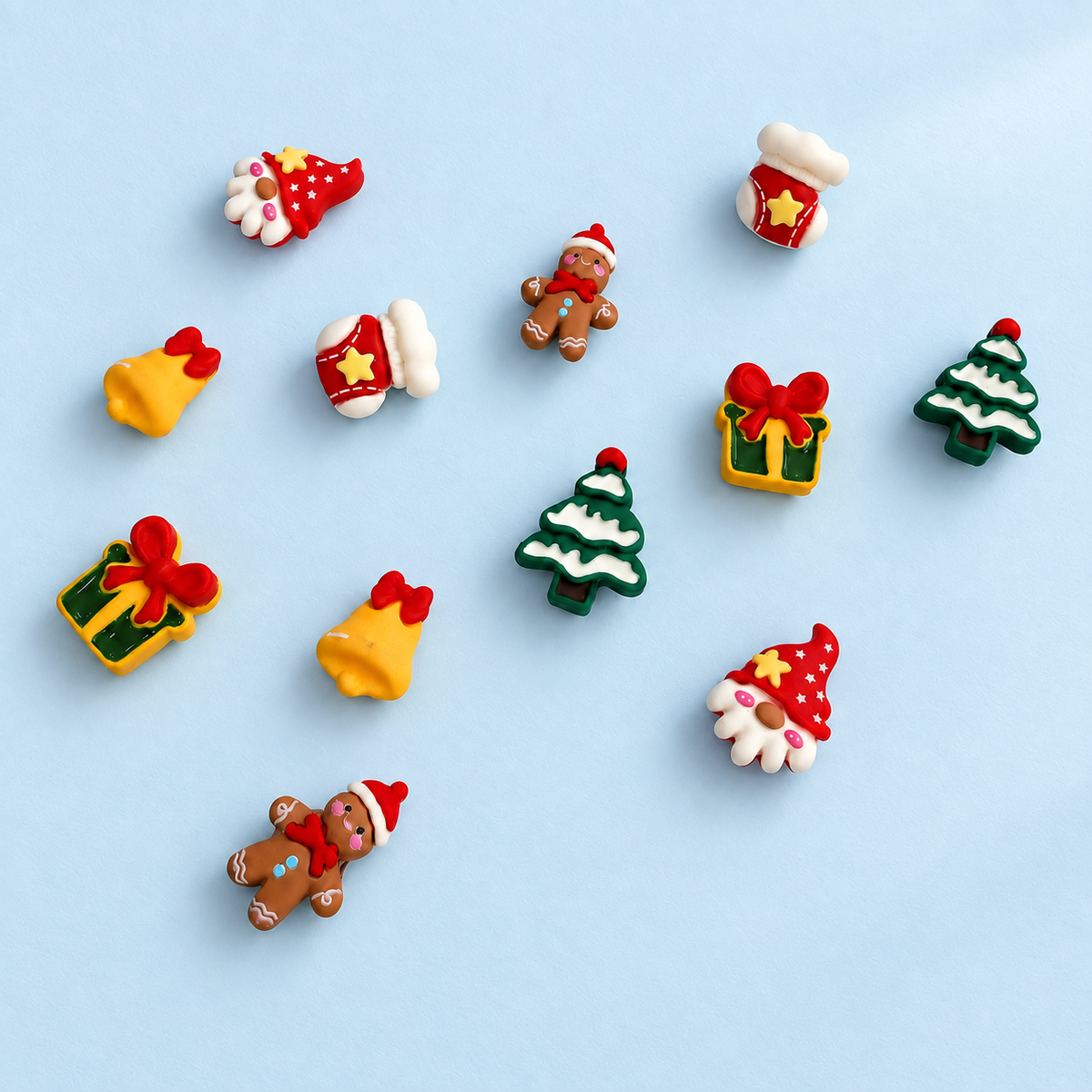 Christmas dog collar charms featuring gnome, gingerbread man, Christmas tree, gift box, bell and stocking designs