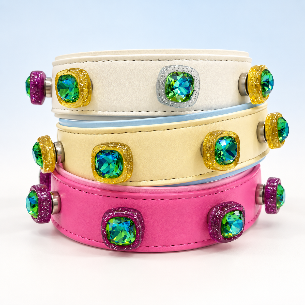 Colorful gem dog collar charms with green faceted stones styled on white, yellow and pink PETIRIA collars