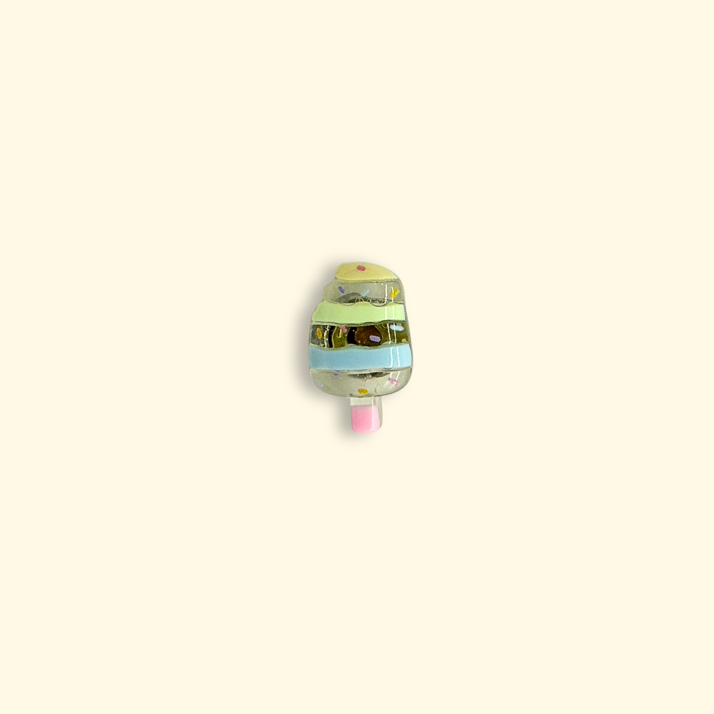 Colorful popsicle charm with green and pink design, ideal for adding charm to your pet's collar