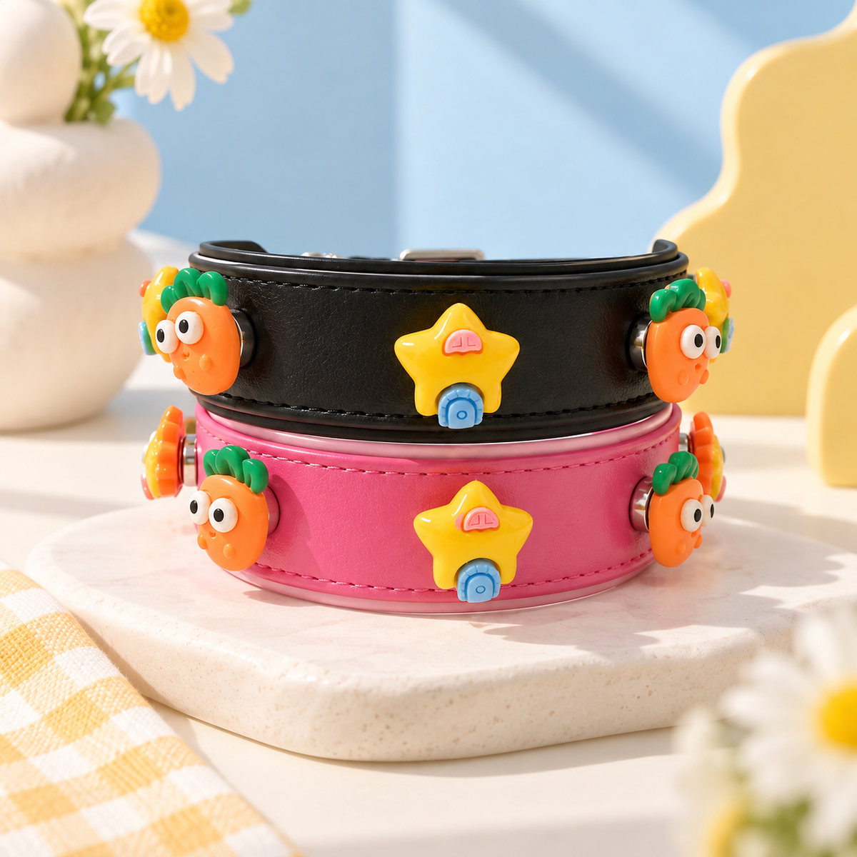 Colorful playful dog collar charms styled on black and pink PETIRIA collars with cute cartoon-inspired designs