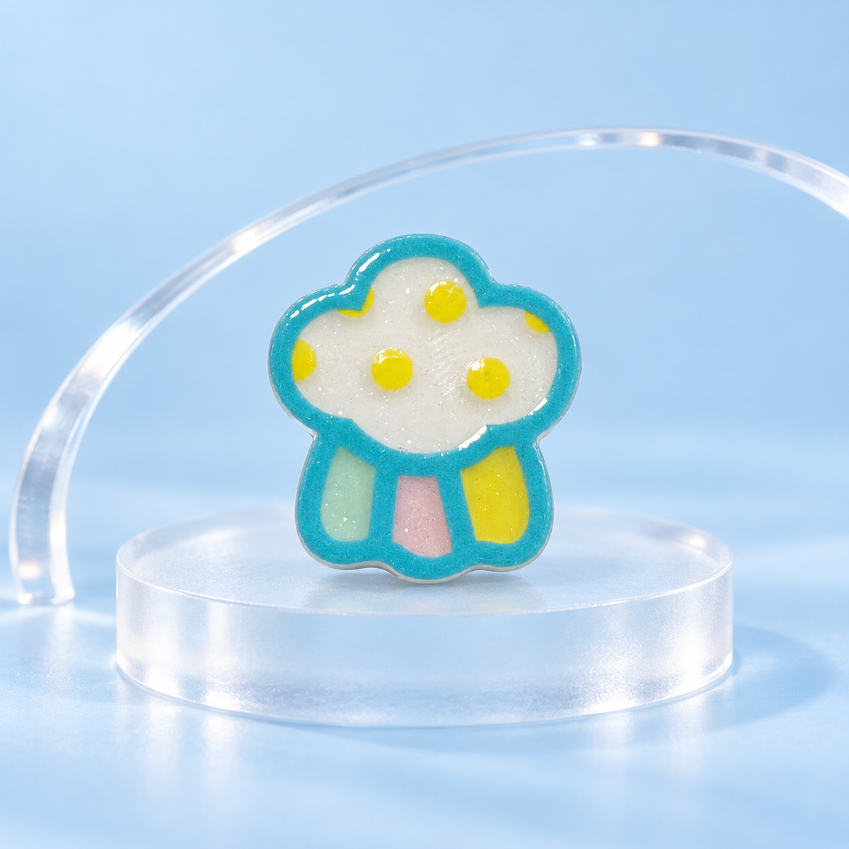 Cosmic Flower dog collar charm with white petals, yellow details and a turquoise outline