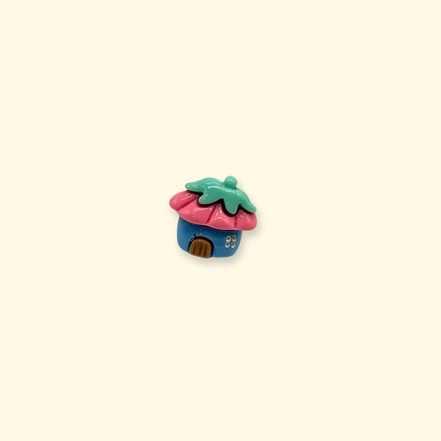 Small cottage house dog collar charm in kawaii style with green roof and pink details, snap-on pet collar accessory