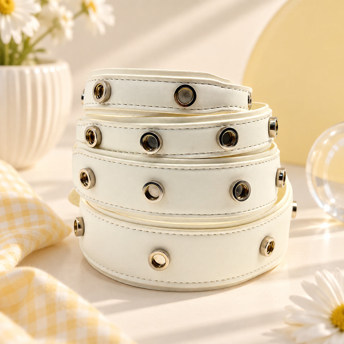 Cream PETIRIA interchangeable dog collars in multiple sizes with snap-on charm attachment points