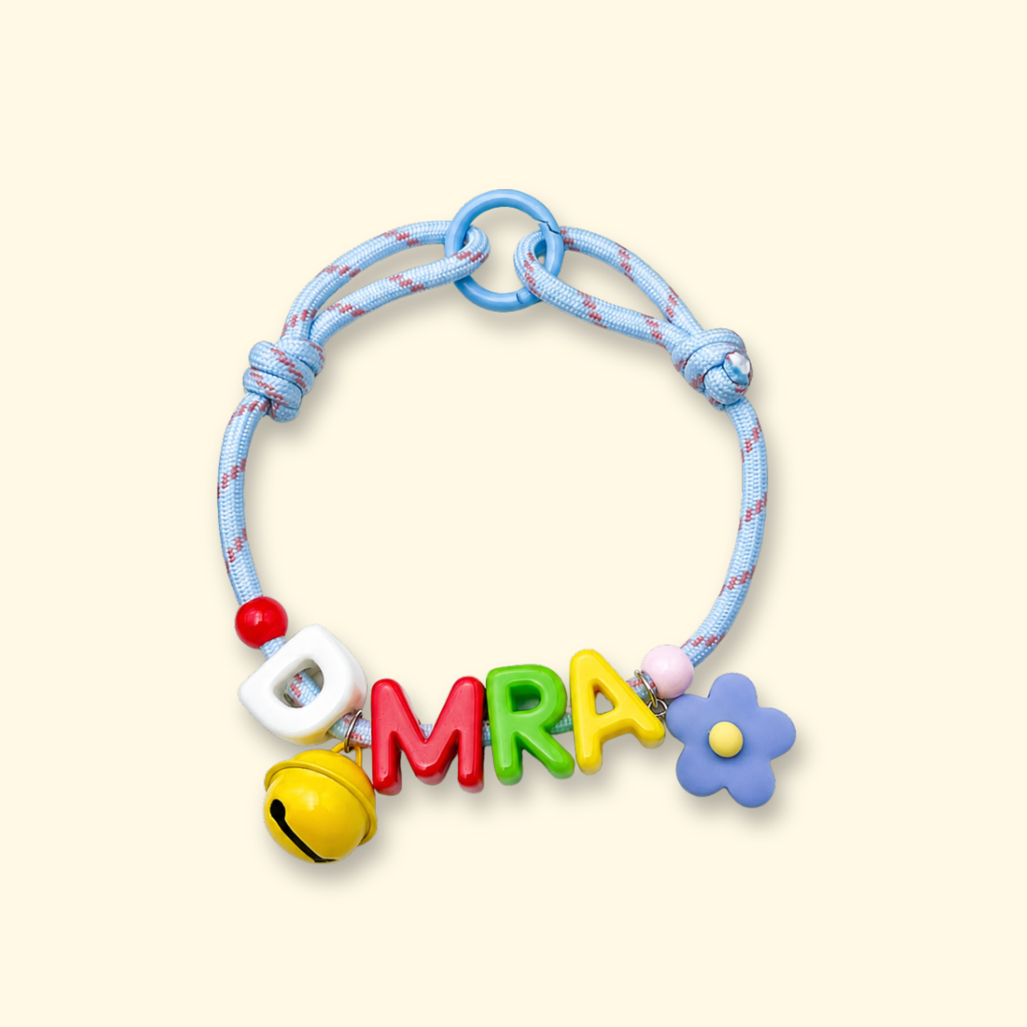 Personalized dog collar with colorful letter charms spelling DMRA, custom pet name collar with interchangeable alphabet charms