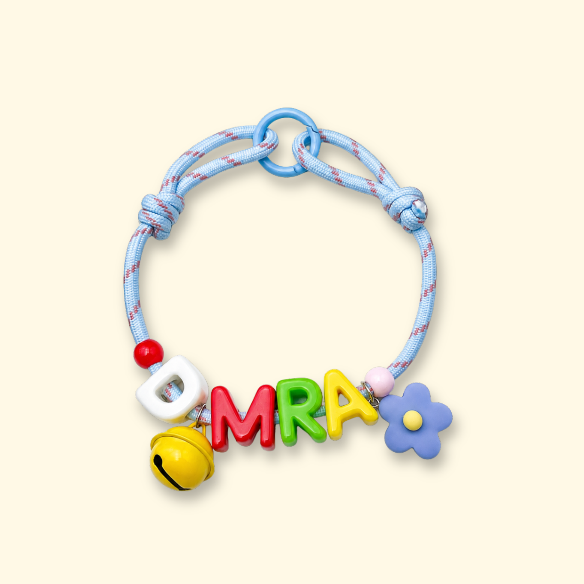Personalized dog collar with colorful letter charms spelling DMRA, custom pet name collar with interchangeable alphabet charms