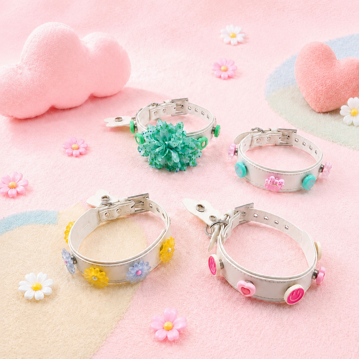 Multiple PETIRIA white dog collars customized with different removable charms, showing various personalized styles for pets.