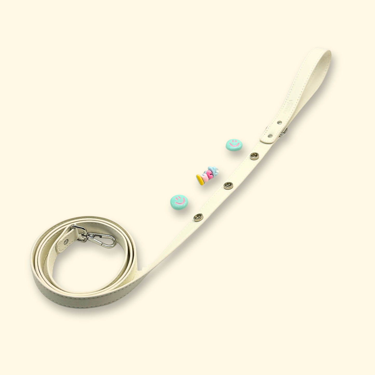 White dog leash with removable interchangeable charms for cats and dogs