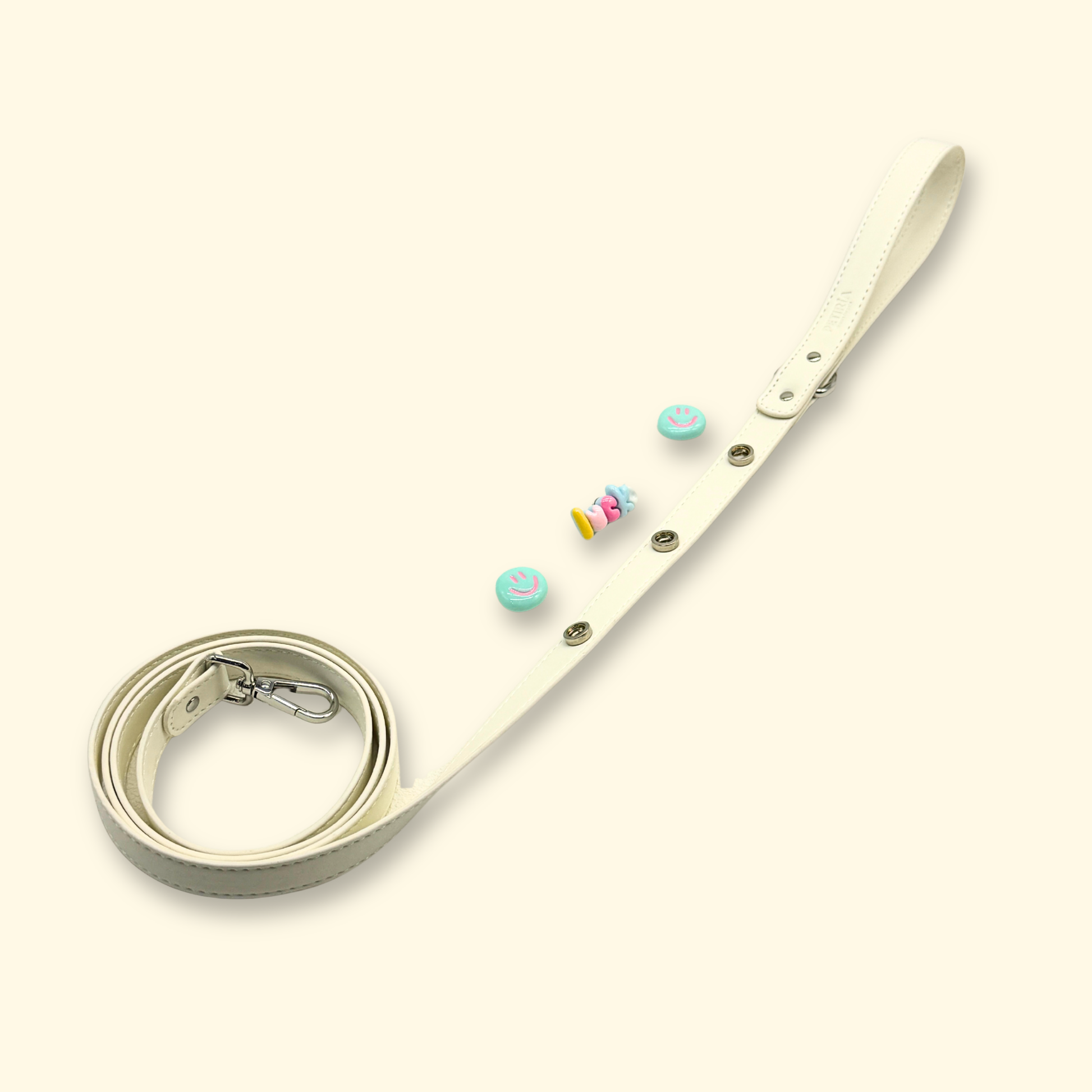White dog leash with removable interchangeable charms for cats and dogs