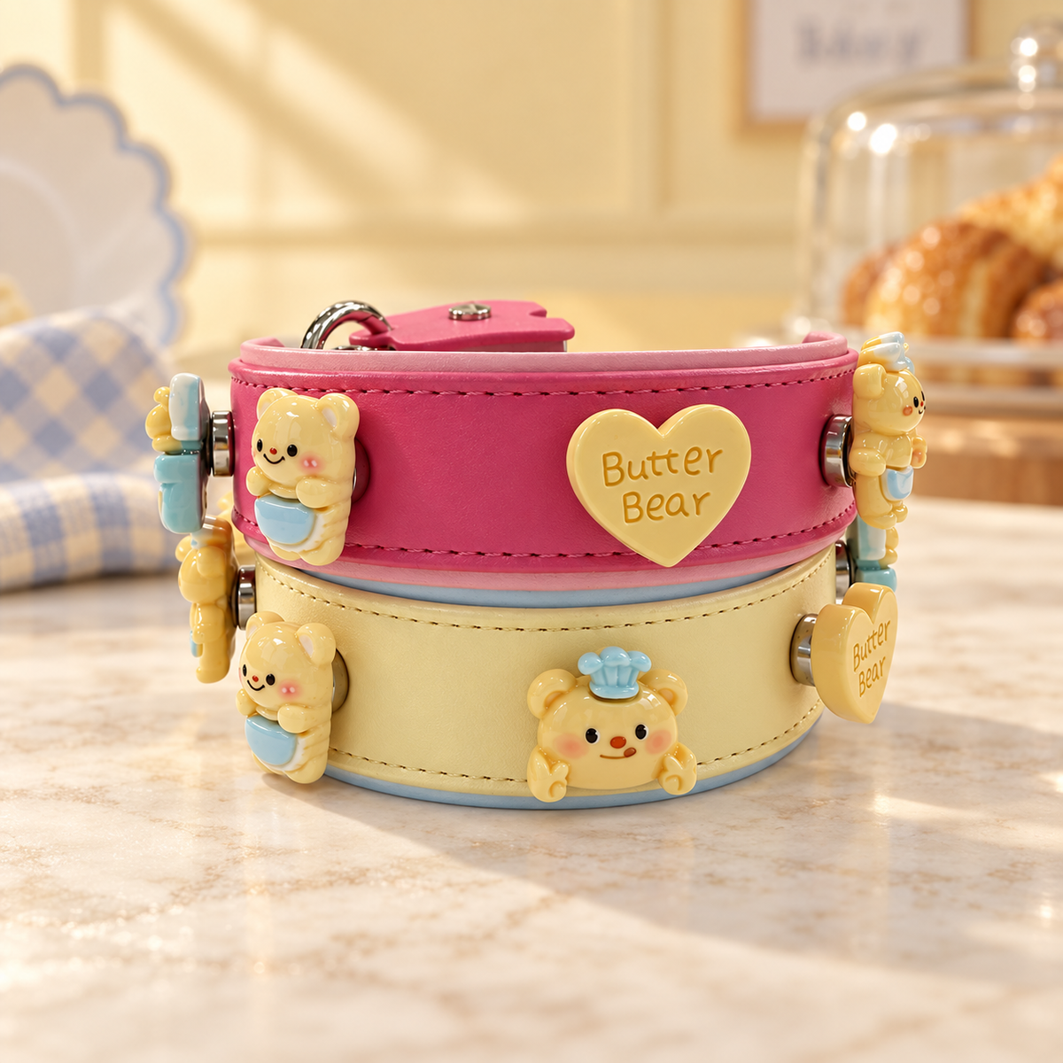 Cute bear dog collar charms styled on pink and yellow PETIRIA collars with playful Butter Bear designs