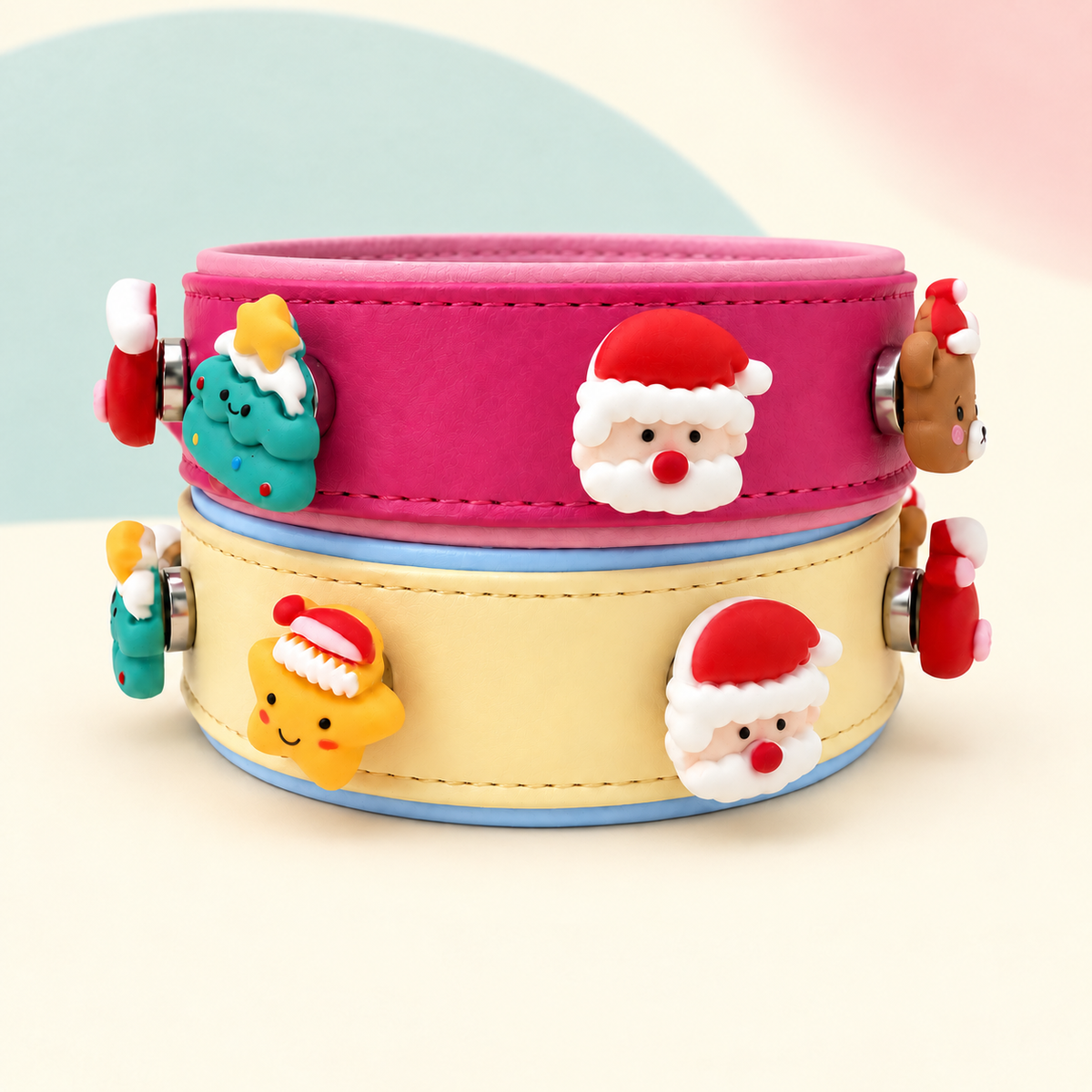 Cute Santa Christmas dog collar charms styled on pink and cream Petiria collars with Santa, Christmas tree, bear and star designs