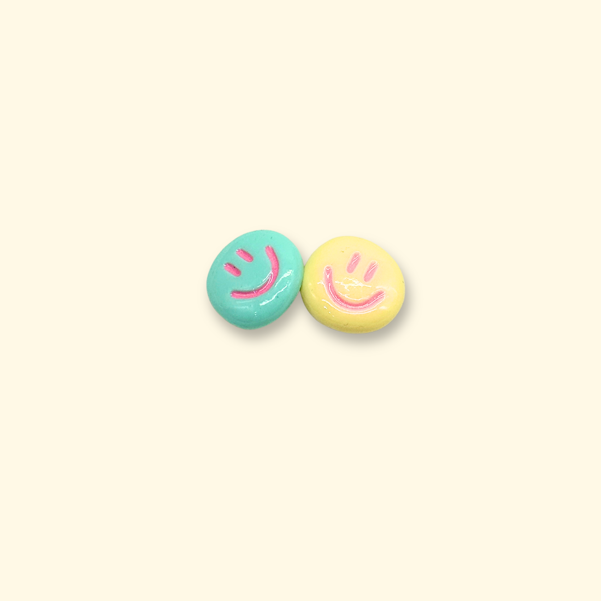 Pastel-colored smiley face and flower charms for pet collars, perfect for a cheerful and stylish look