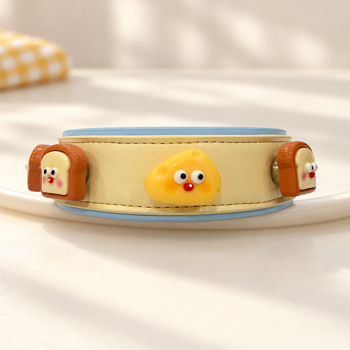 Yellow PETIRIA collar styled with cute snack dog collar charms featuring toast and golden snack characters