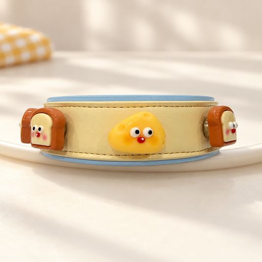 Yellow PETIRIA collar styled with cute snack dog collar charms featuring toast and golden snack characters