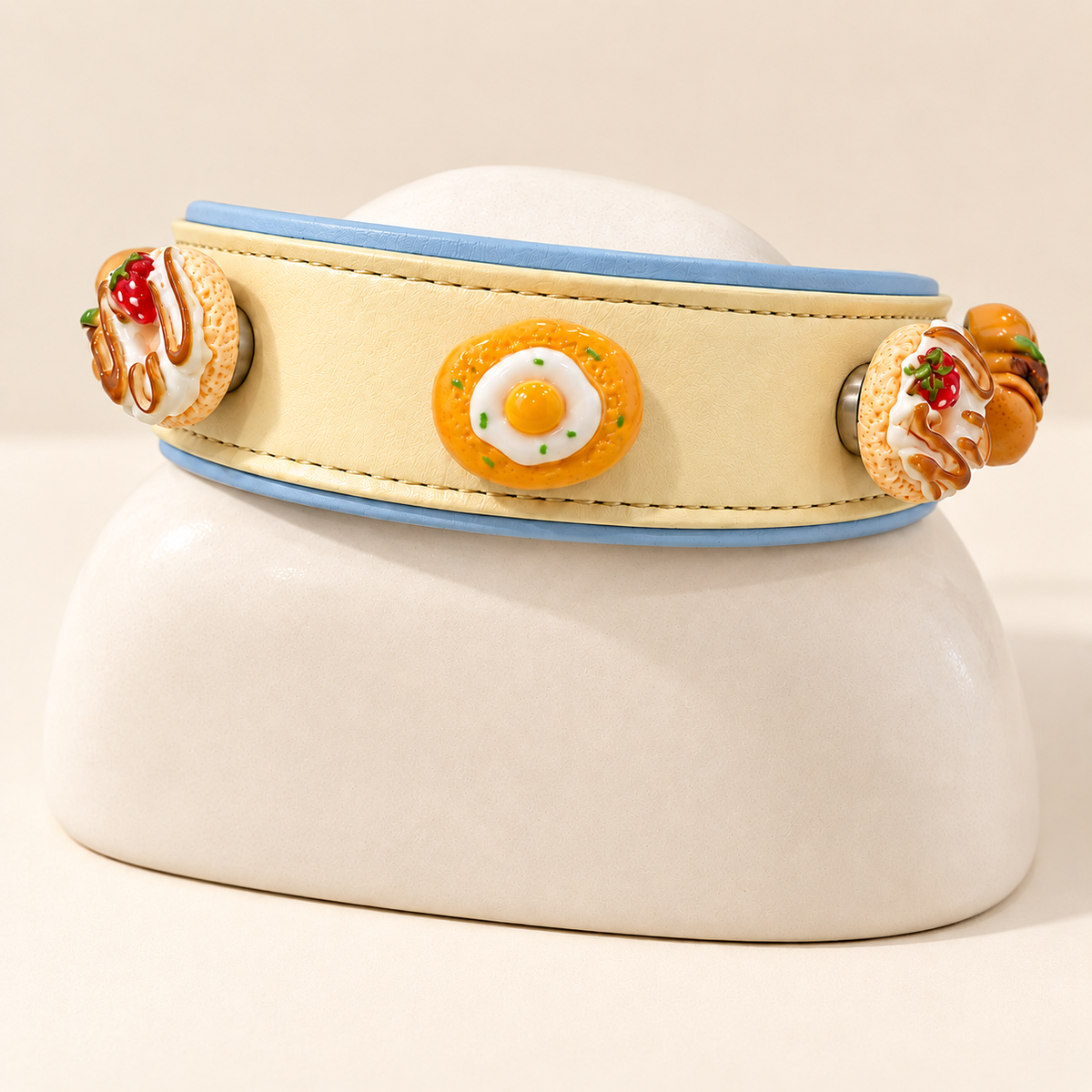 Yellow PETIRIA collar styled with fried egg, burger and strawberry food dog collar charms