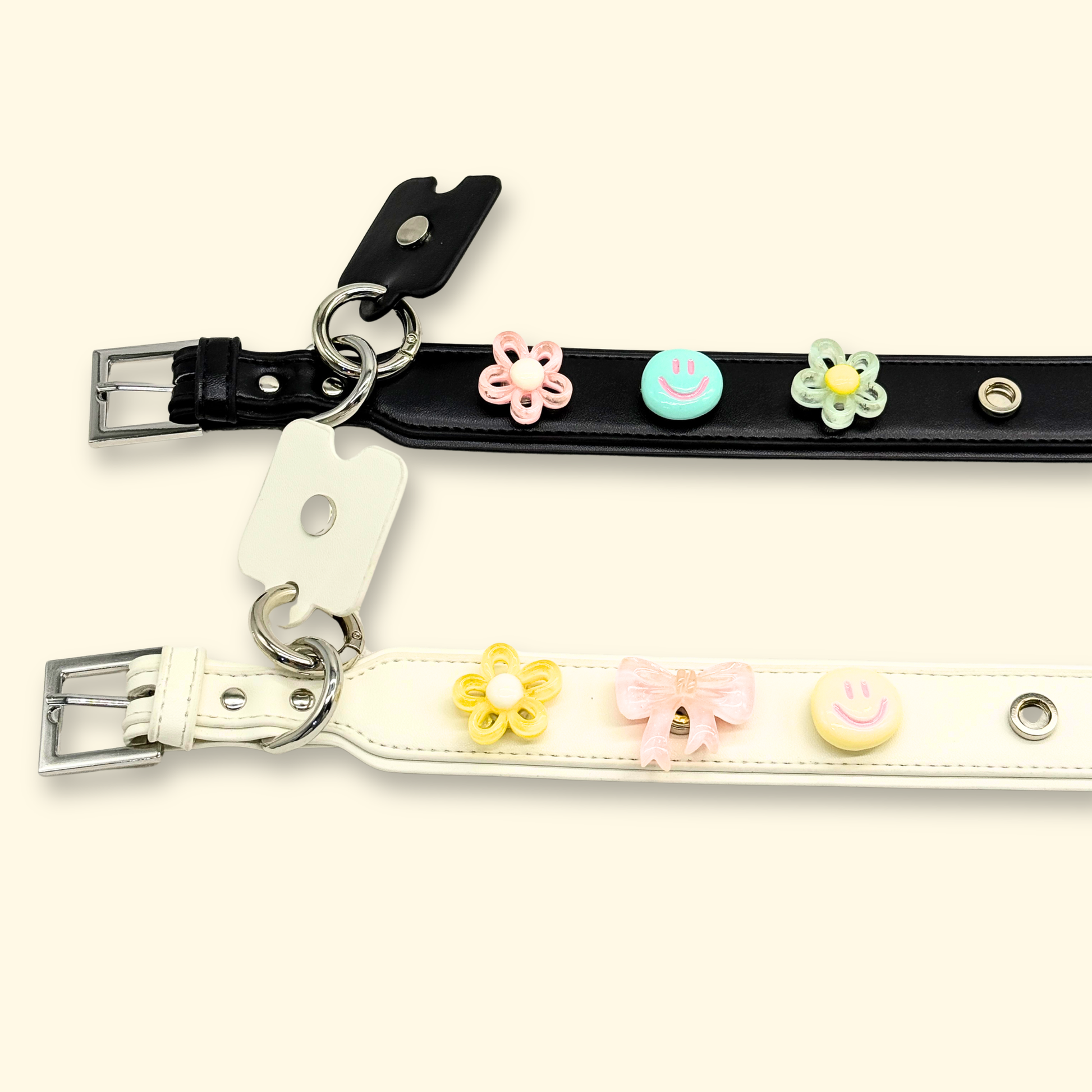 Black and white pet collars with playful flower and smiley charms, adding a fun touch to any pet outfit