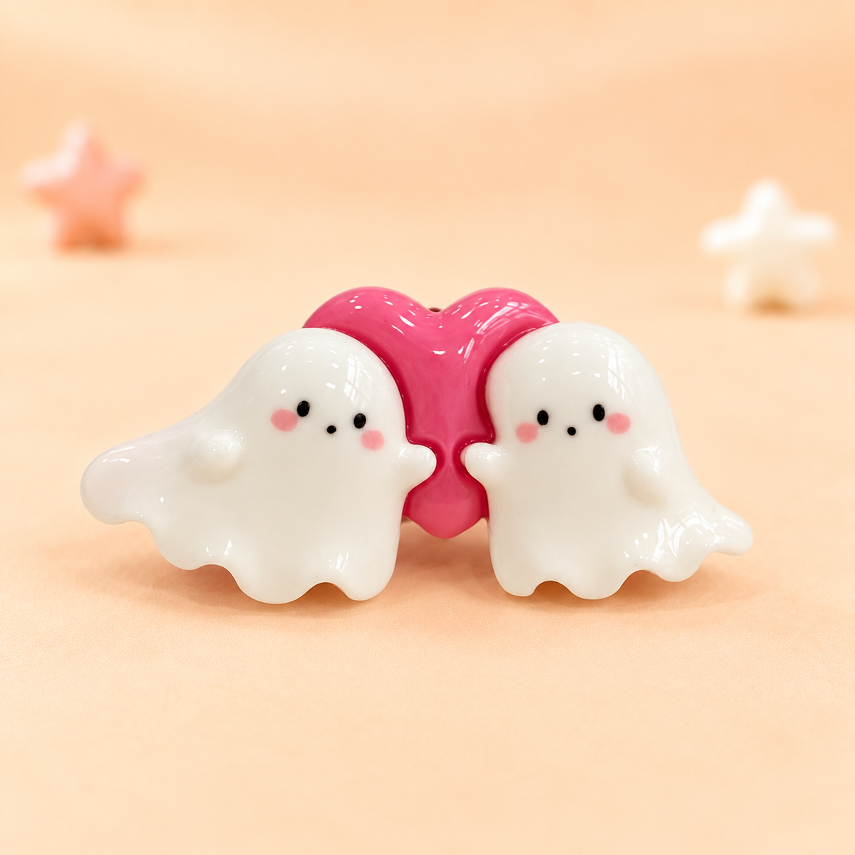 Two cute white ghost dog collar charms with a pink heart for a playful Halloween look