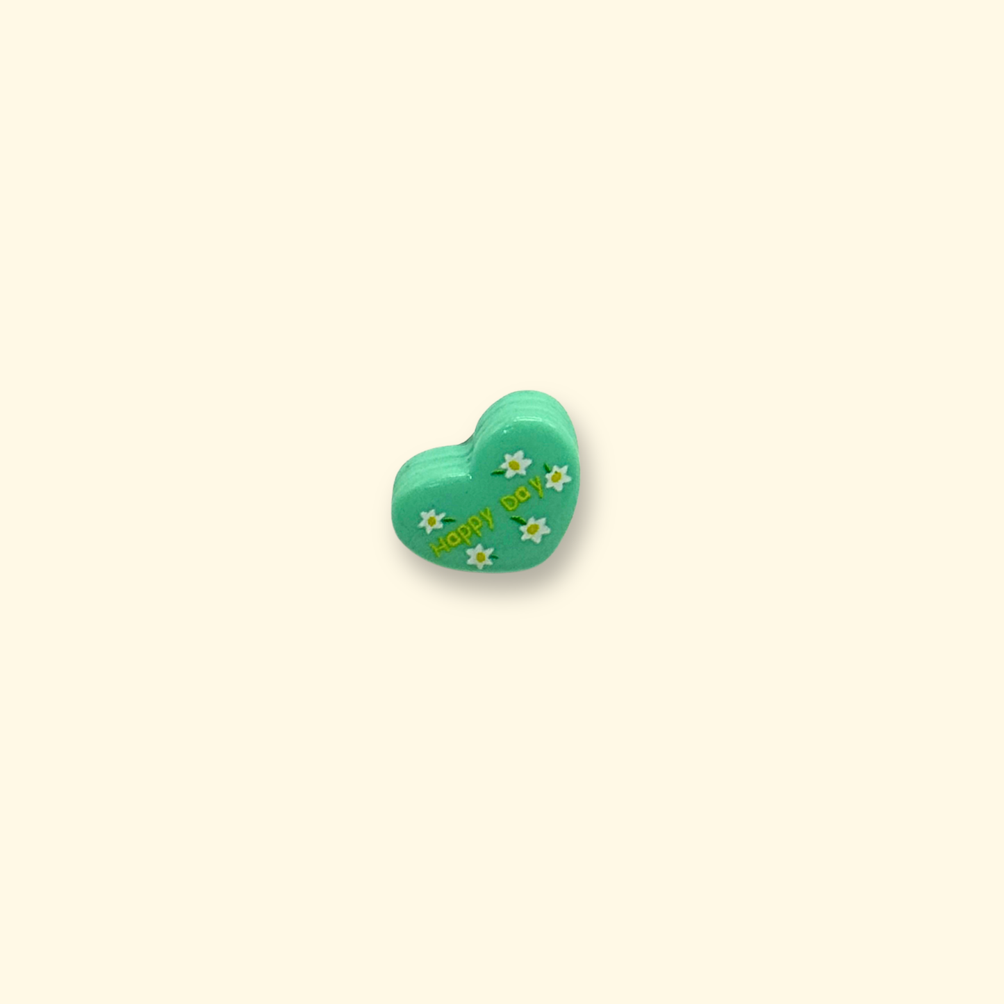 Green heart-shaped pet collar charm with "Happy Day" text and white flower accents