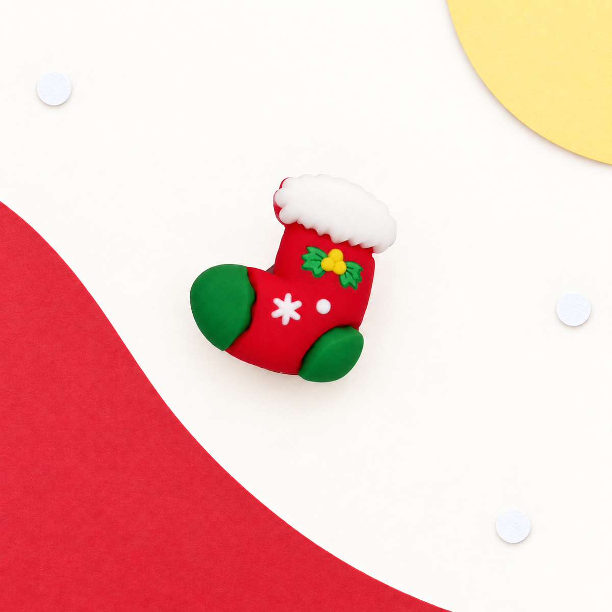Red and green Christmas stocking dog collar charm with white snowflake and holly details for festive holiday styling