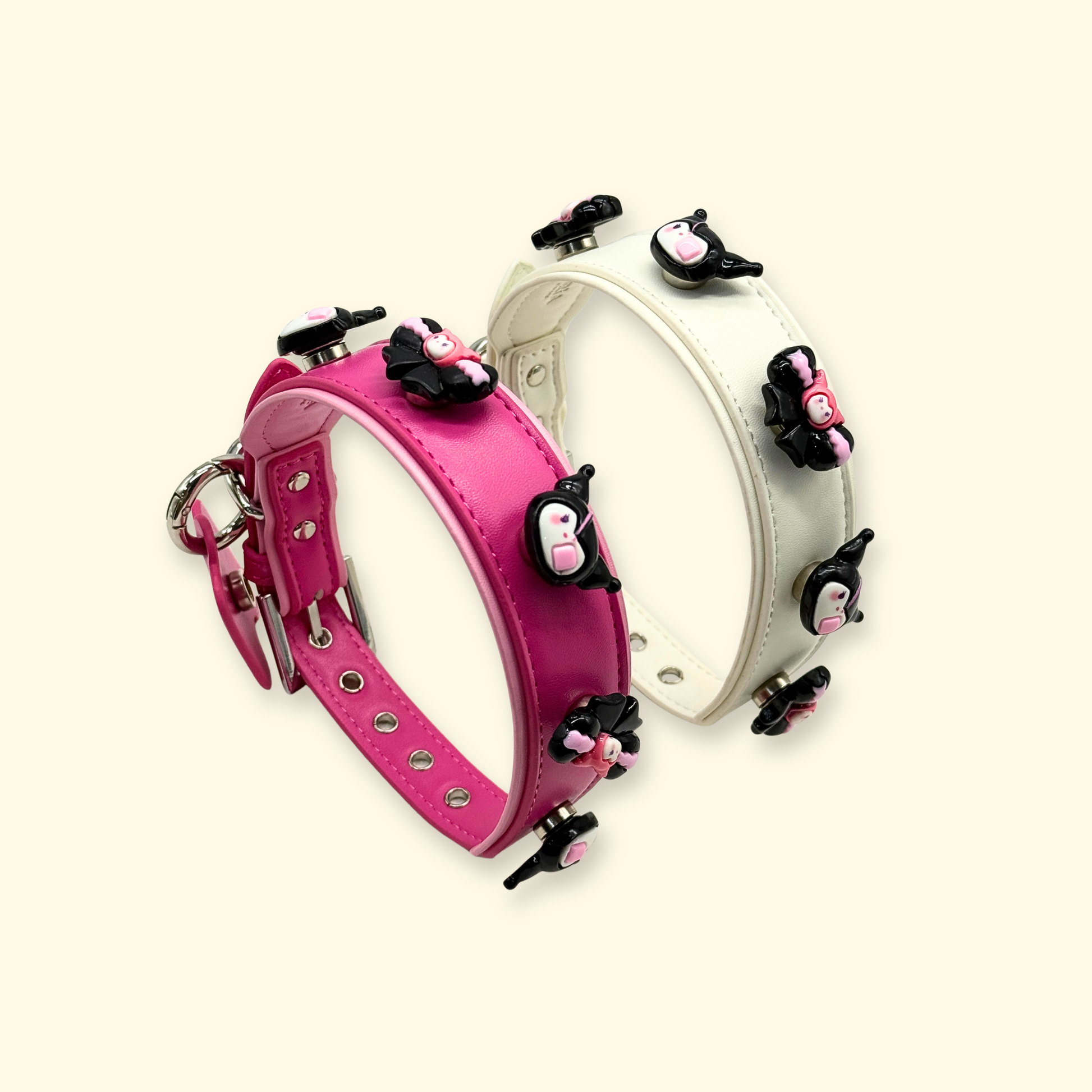 Stacked pink and white dog collars with Kuromi-style snap-on charms, modular pet charm system for styling and customization