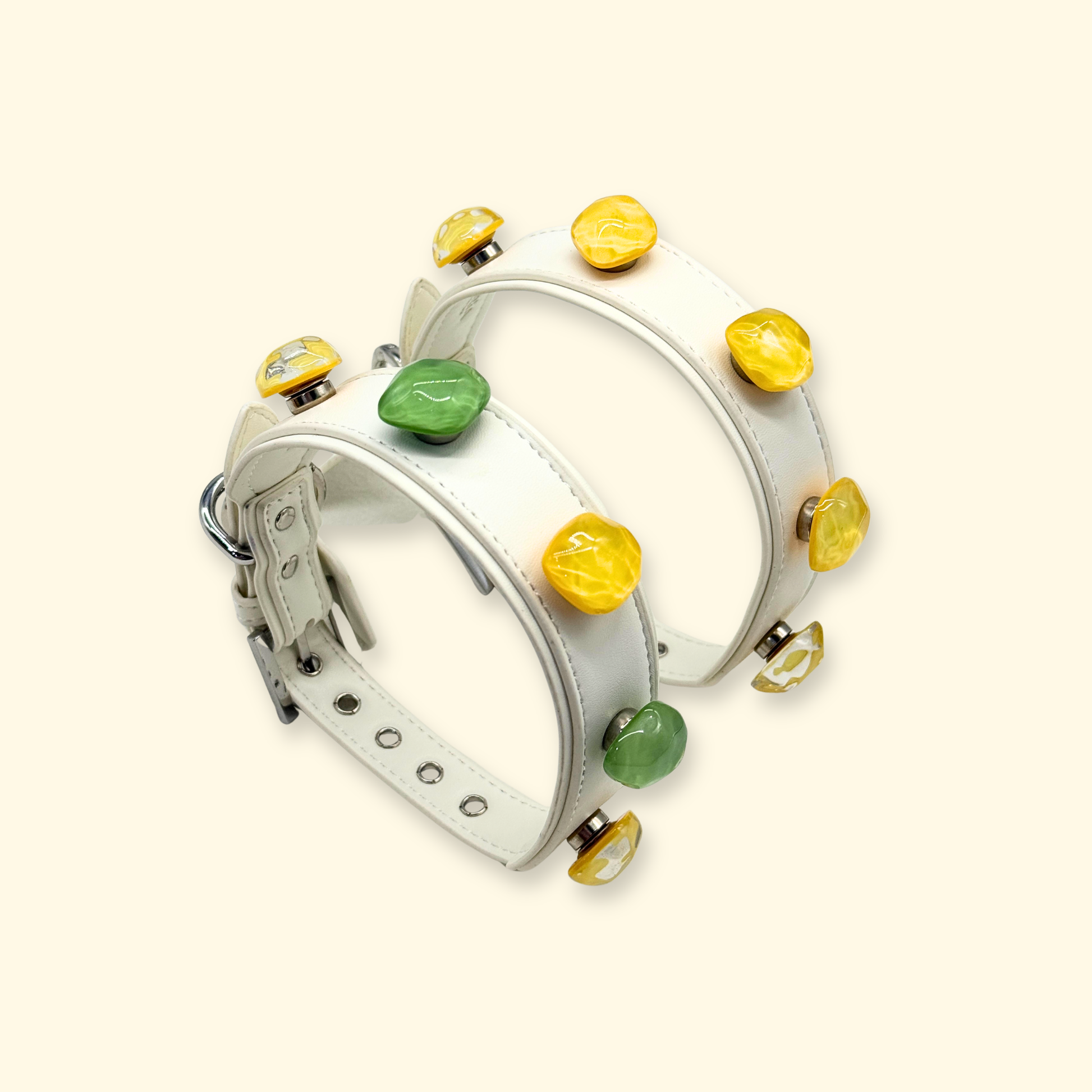 product display of interchangeable dog collar system featuring white leather collars decorated with green jade charm and amber yellow resin charms, DIY pet collar accessories set for customization