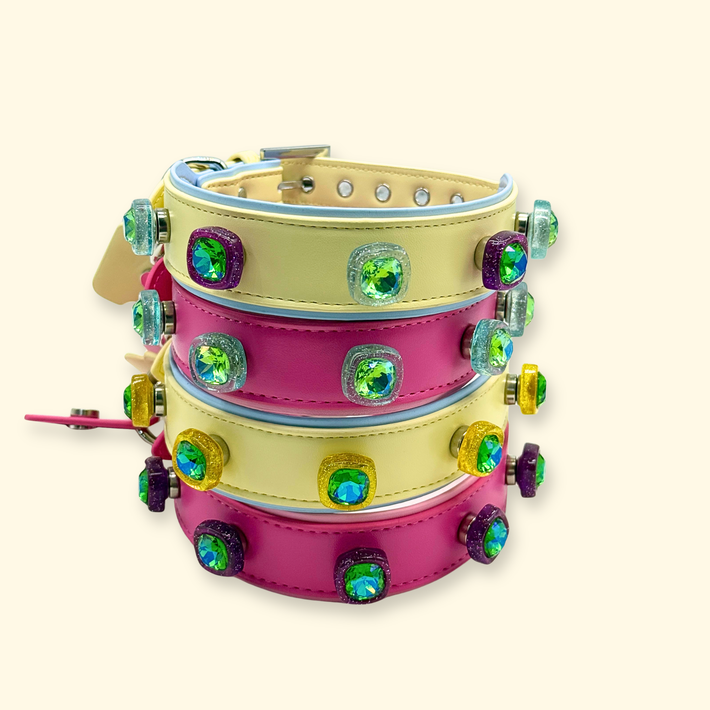 Set of interchangeable dog collars in pink, yellow, and black with crystal snap-on charms for customization