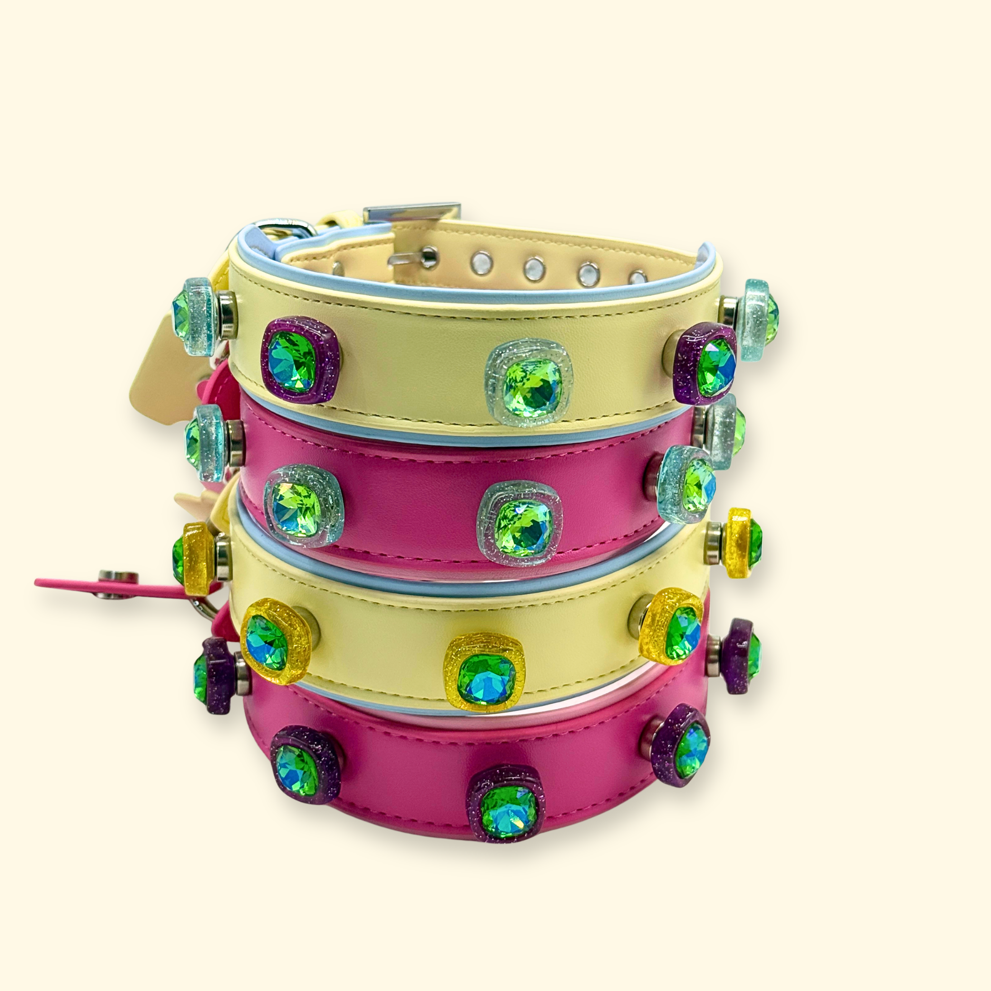 Set of interchangeable dog collars in pink, yellow, and black with crystal snap-on charms for customization