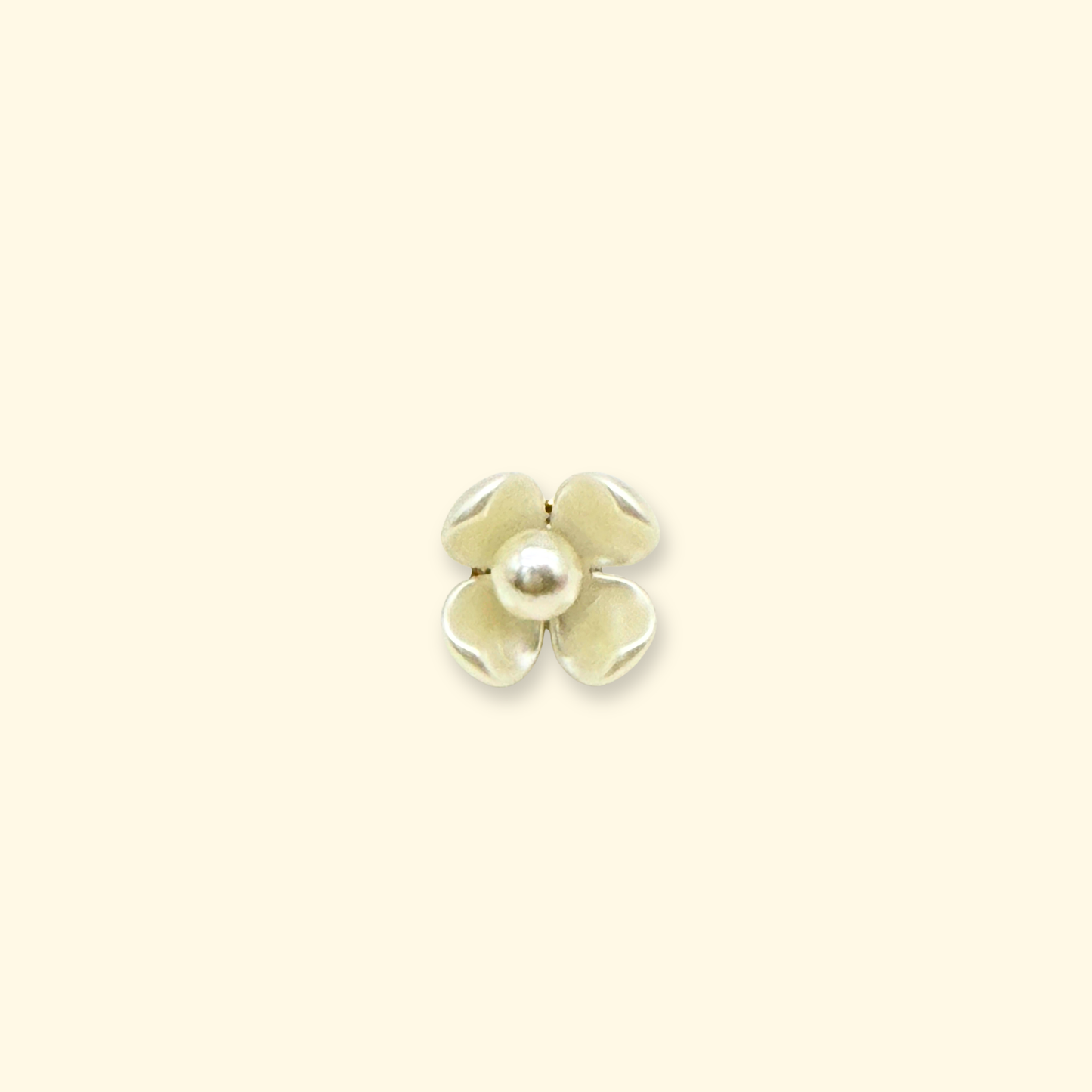Ivory four-petal flower charm with pearl center designed for interchangeable dog collars