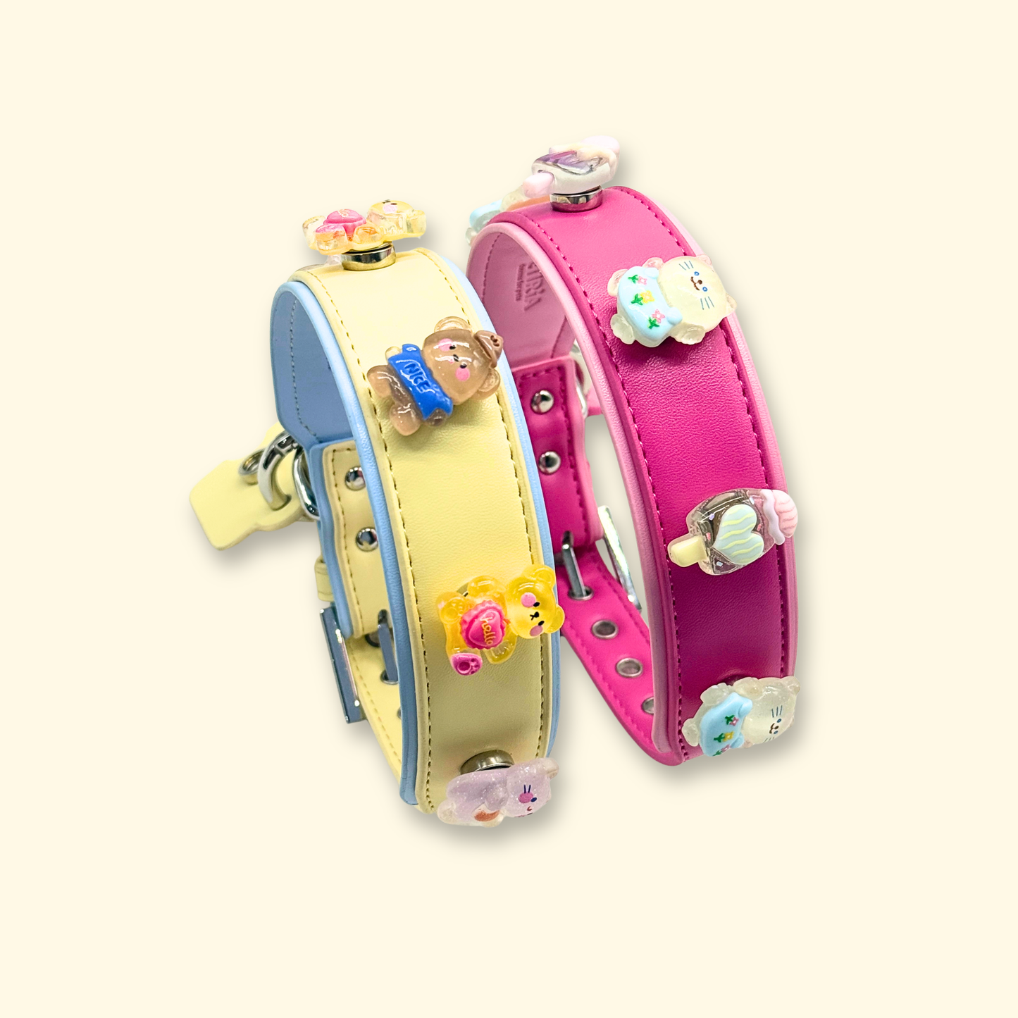 Cute kawaii dog collar charms displayed on pink and pastel yellow pet collars featuring bear, bunny, cat, and ice cream snap-on charms for stylish pet accessories