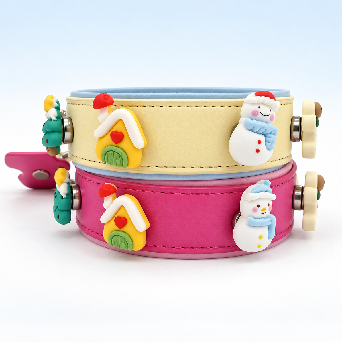 Cream and pink Petiria collars styled with cozy Christmas tree, snowman, mitten and little holiday house charms
