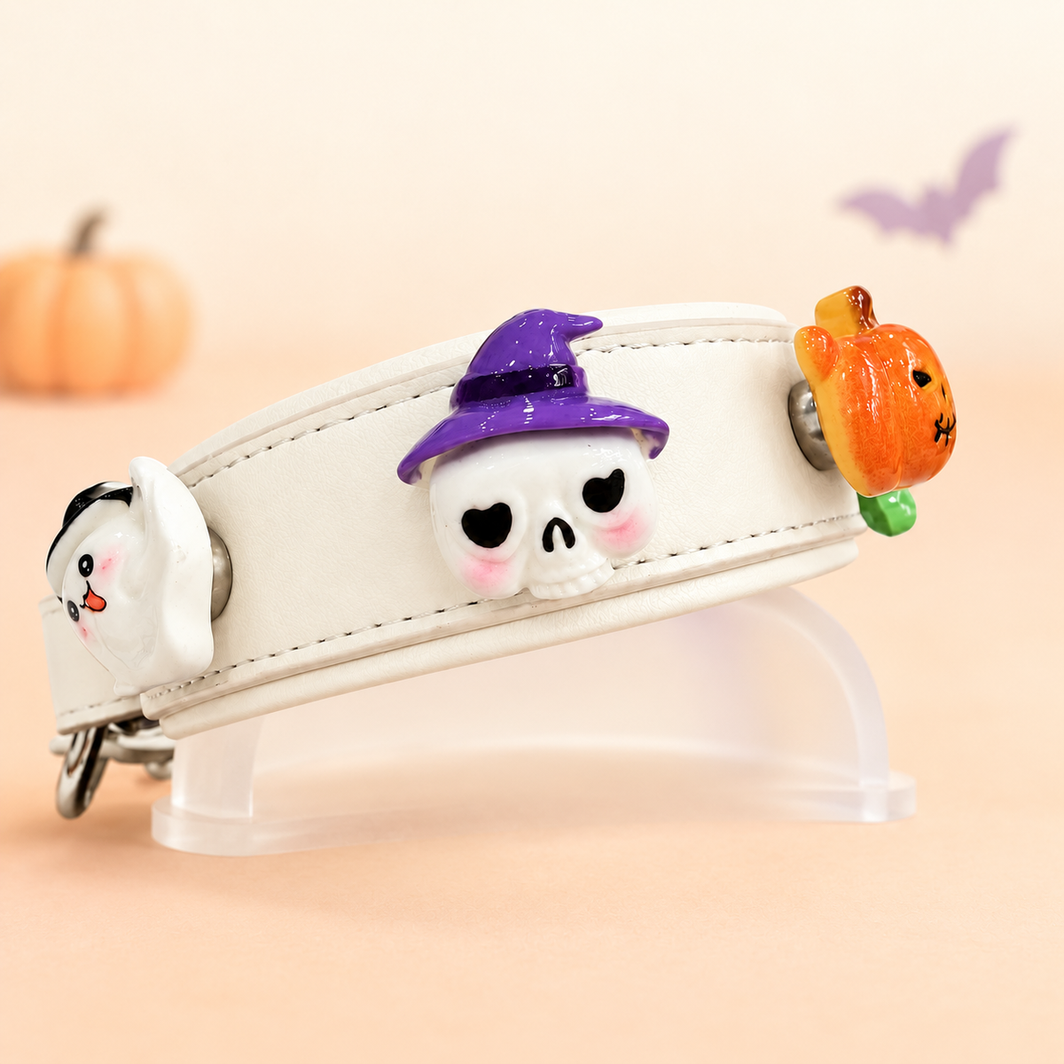 White Petiria collar styled with pumpkin, skull and spooky Halloween dog collar charms