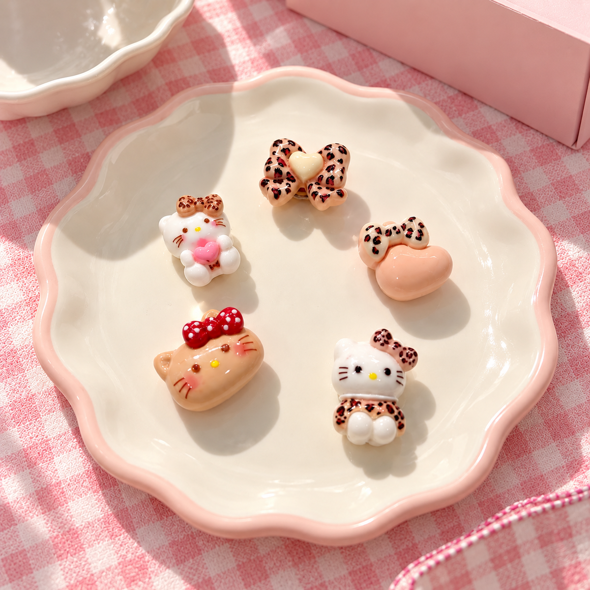 Leopard print dog collar charms featuring cat-shaped designs, bows and heart details