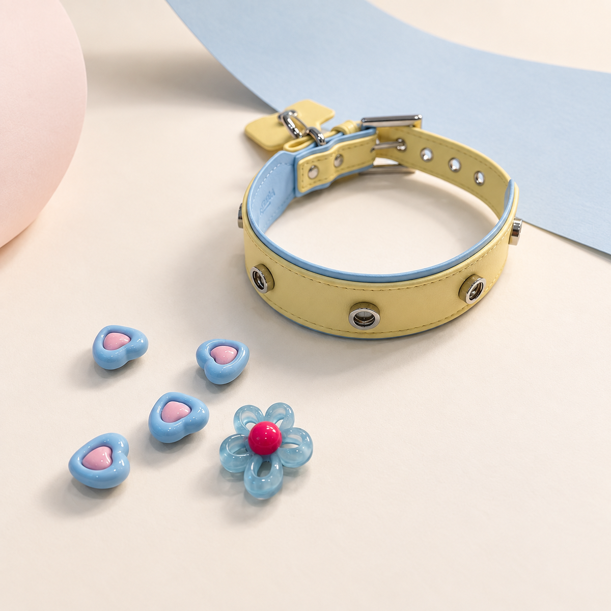 Yellow Petiria dog collar styled with colorful heart and flower snap-on collar charms