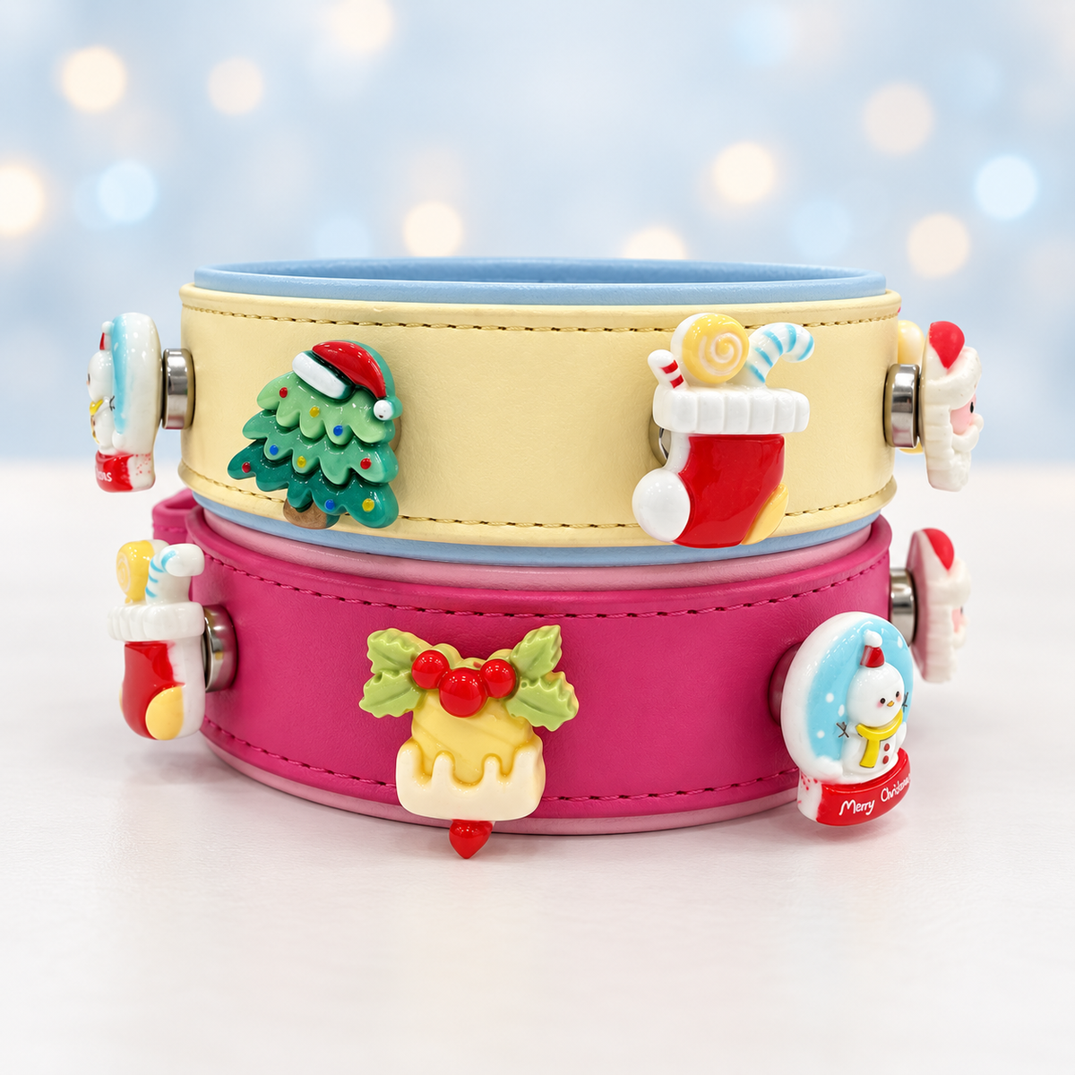 Cream and pink Petiria collars styled with snowman, snowy tree, stocking and other winter Christmas dog collar charms