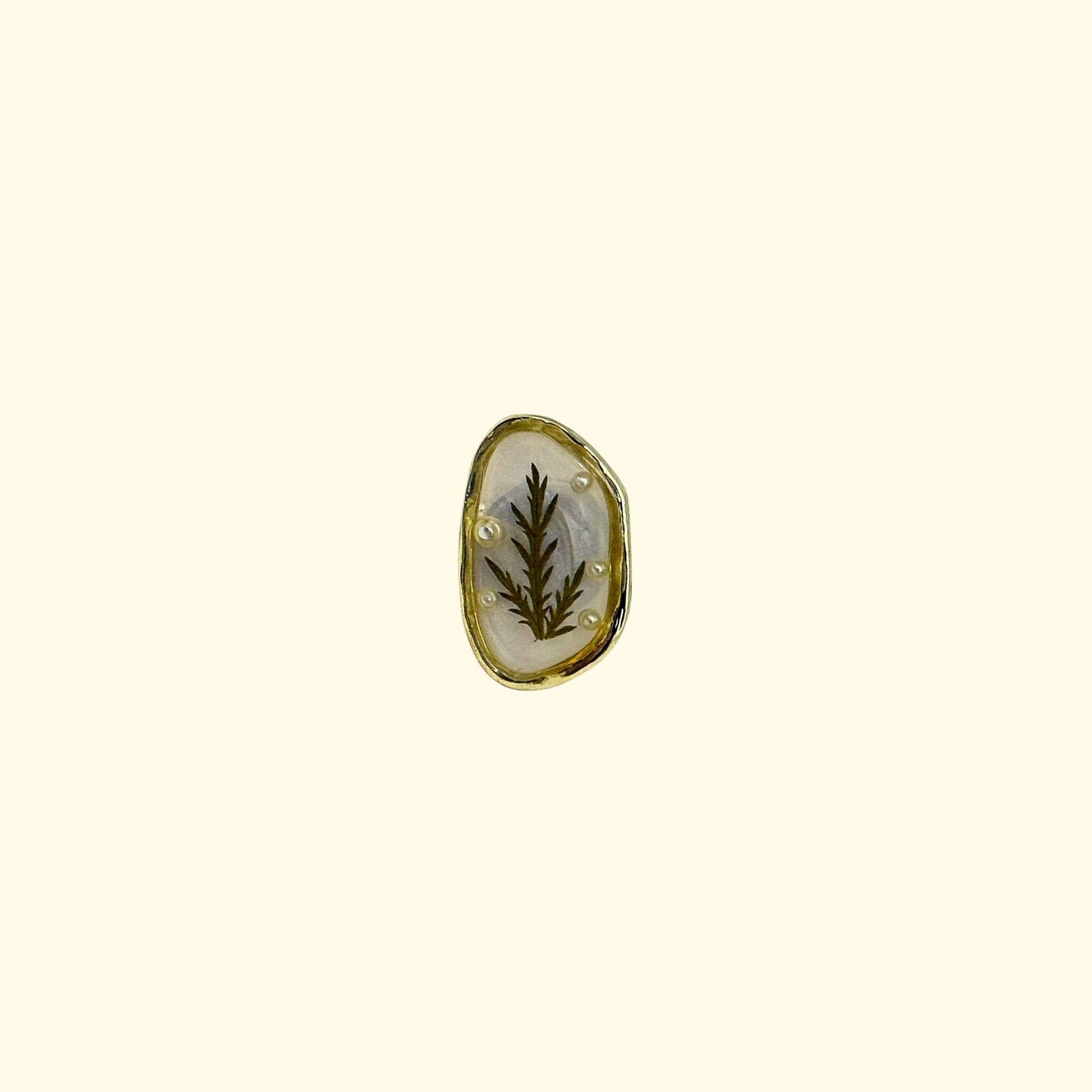 Oval resin dog collar charm with green leaf detail and gold rim, minimalist natural snap-on pet accessory for collars
