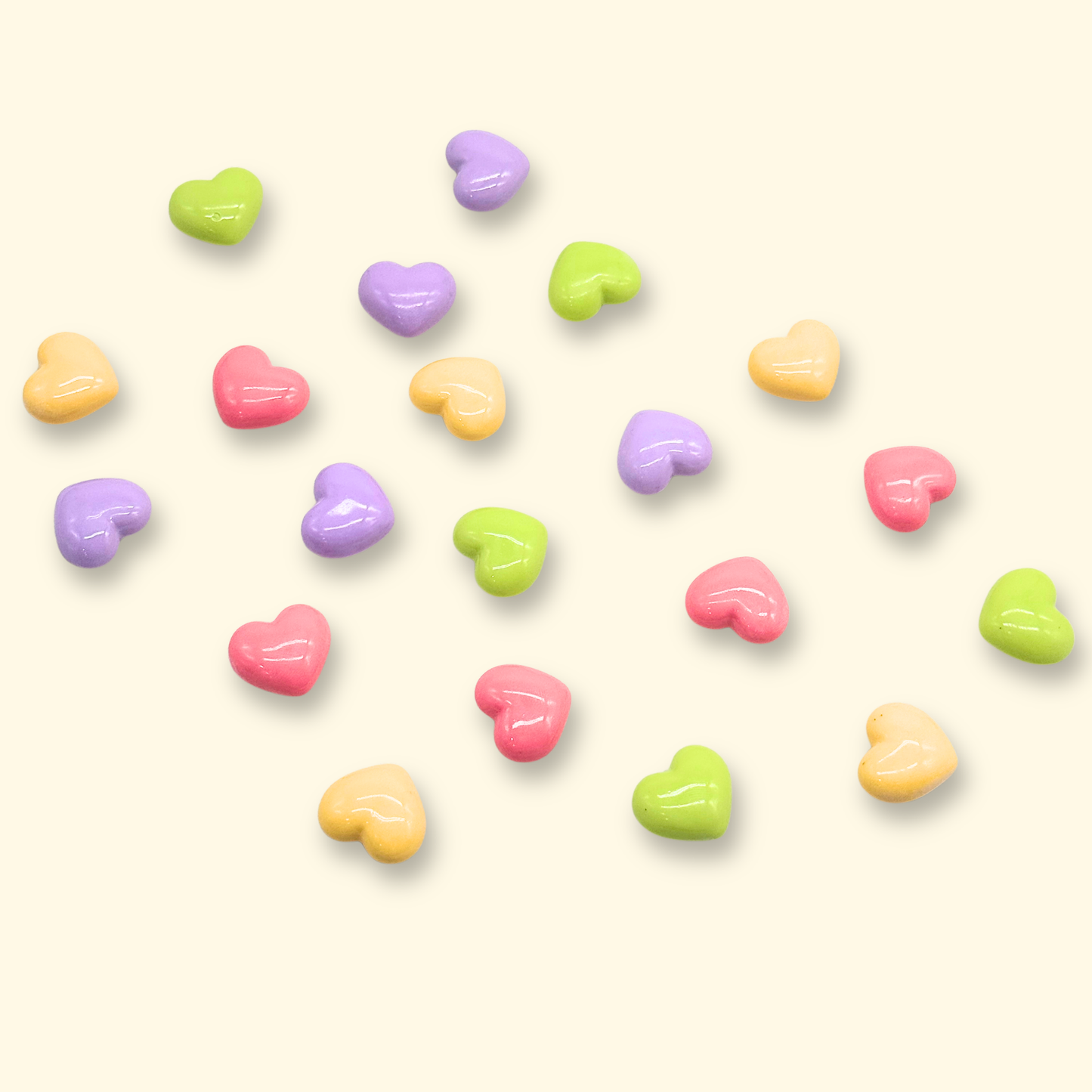 Pastel heart dog collar charms in pink, lavender, lime green, and butter yellow for customizable pet collars and cute dog accessories